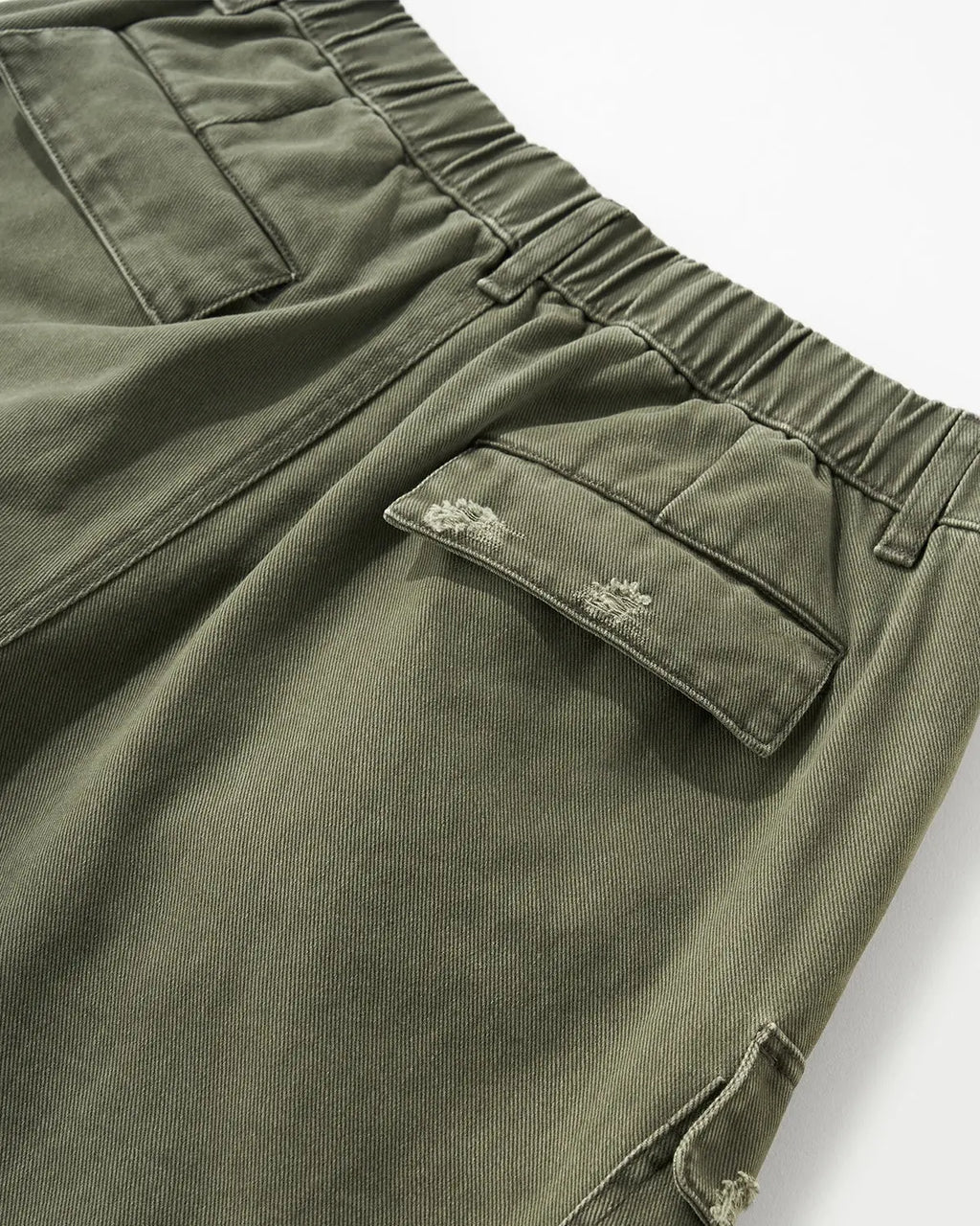 Inflation streetwear ripped cargo pants with distressed details and multiple pockets, casual urban style for modern street fashion.