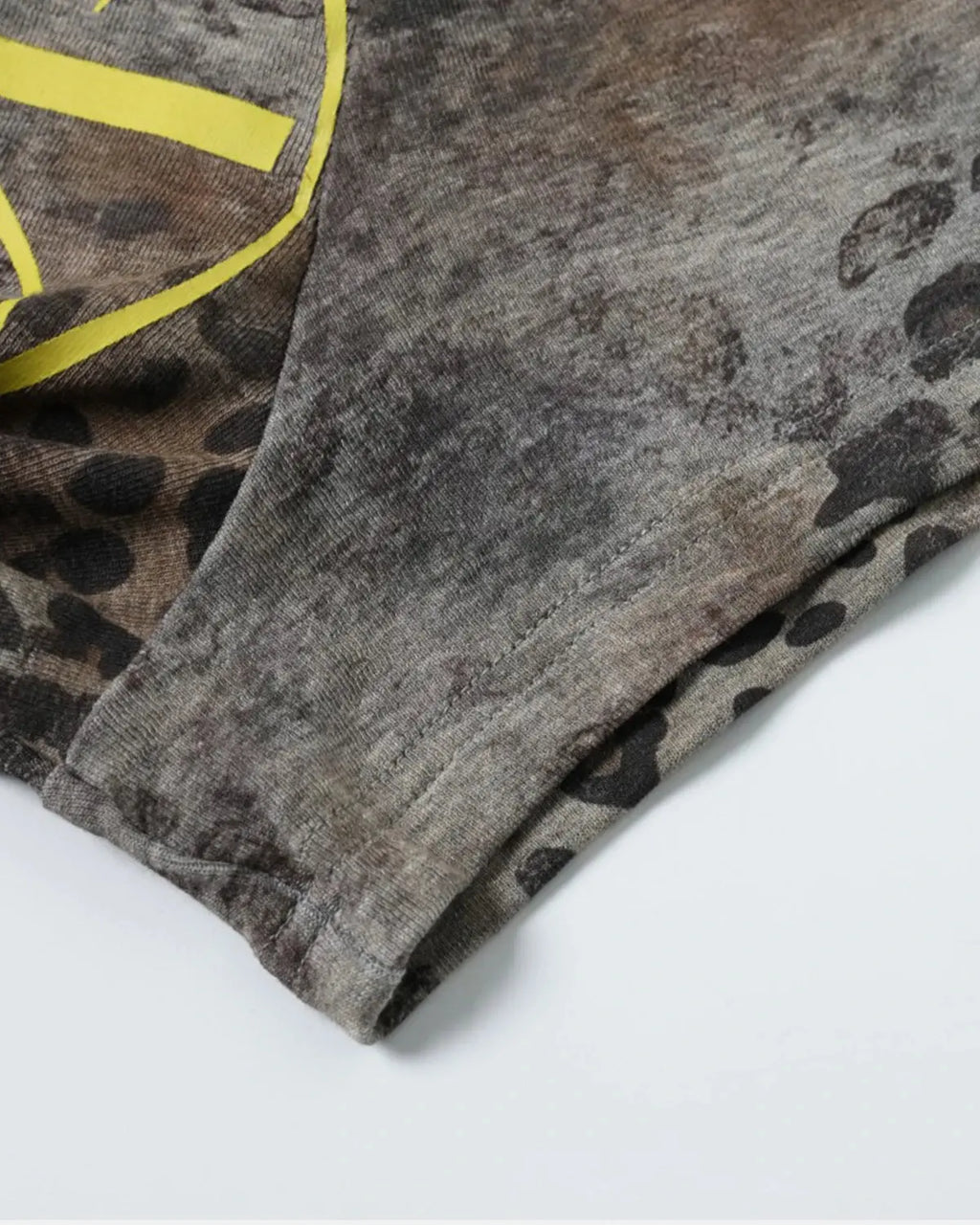 Leopard script Henley baby tee by INFLATION Streetwear featuring a leopard print design and classic Henley neckline.