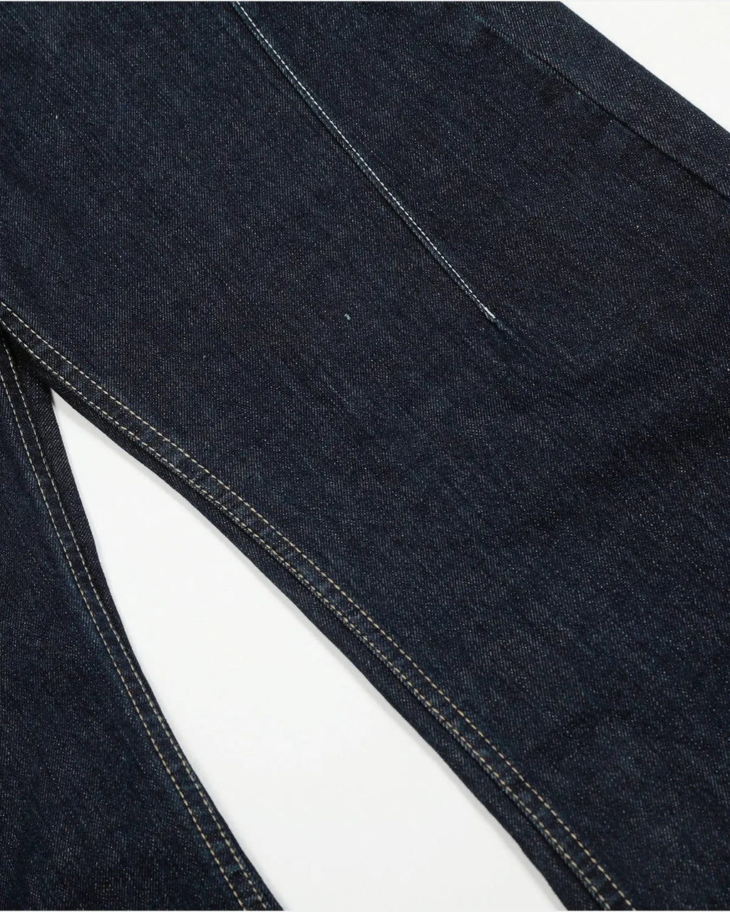 Raw blue deconstructed baggy jeans by Inflation Streetwear with distressed details and relaxed fit, shown on a model.