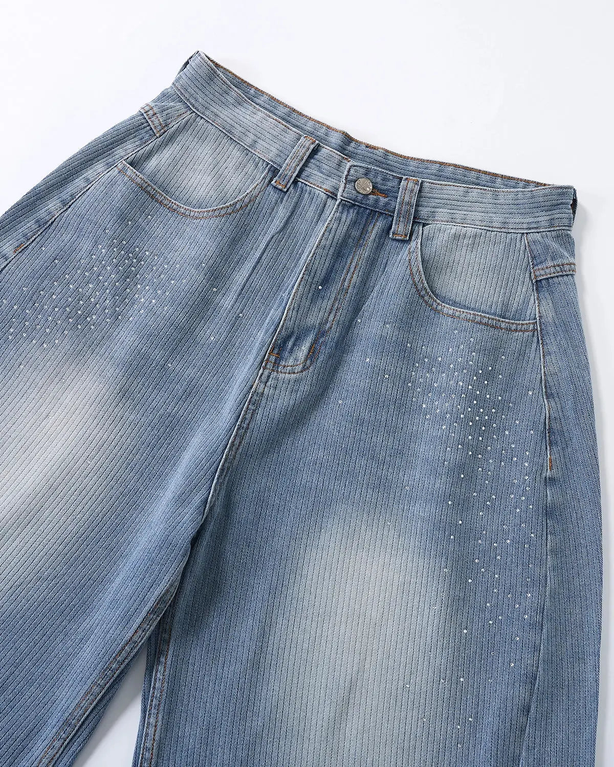 Star rhinestone embellishments on INFLATION longline denim shorts, stylish streetwear pants with a trendy, eye-catching design.