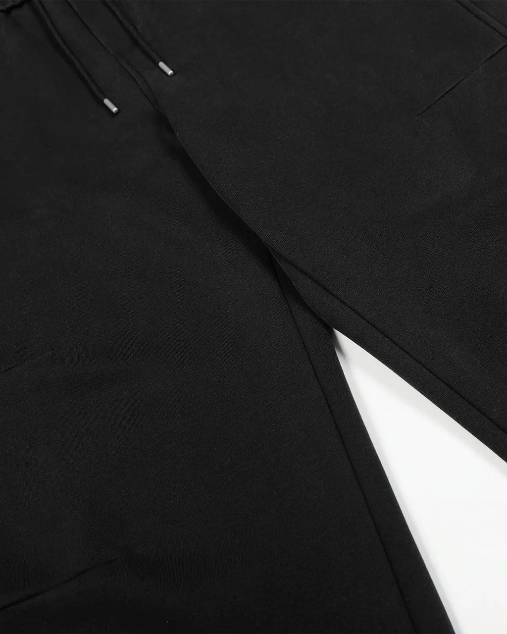 Washed distressed barrel sweatpants by INFLATION featuring a relaxed fit and distressed detailing, perfect for streetwear style.