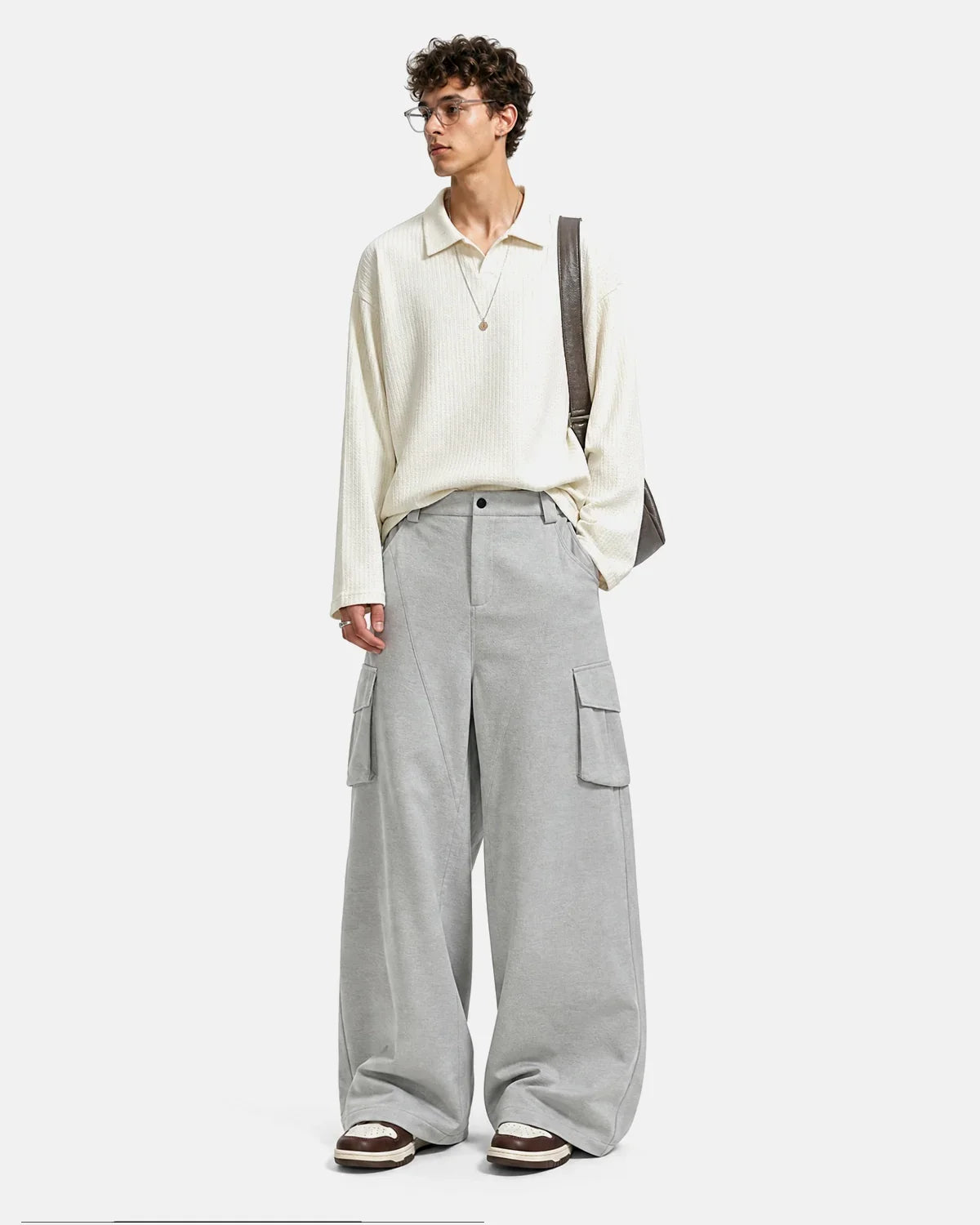 Inflation Streetwear structured wide leg cargo pants with multiple pockets and relaxed fit in neutral fabric, front view.