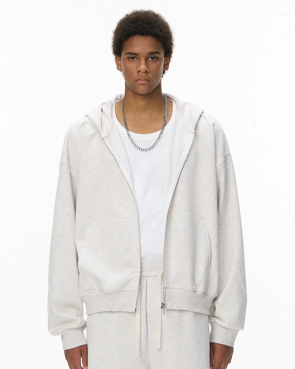 Black French Terry zip-up hoodie from Flation Streetwear with a front pocket and adjustable drawstrings.