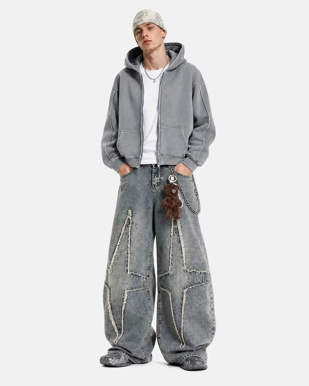 Flation Star Patched Baggy Jeans featuring distressed denim and star patches, casual streetwear style, in a relaxed fit.