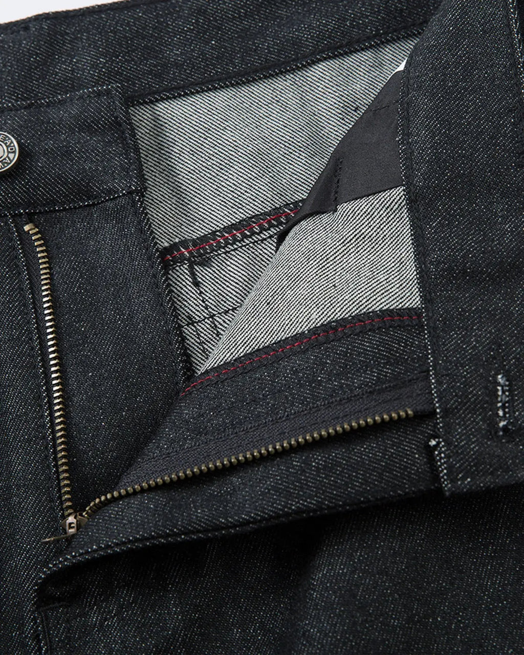 Inflation Super Raw Baggy Jeans with relaxed fit and distressed details, styled for streetwear fashion.