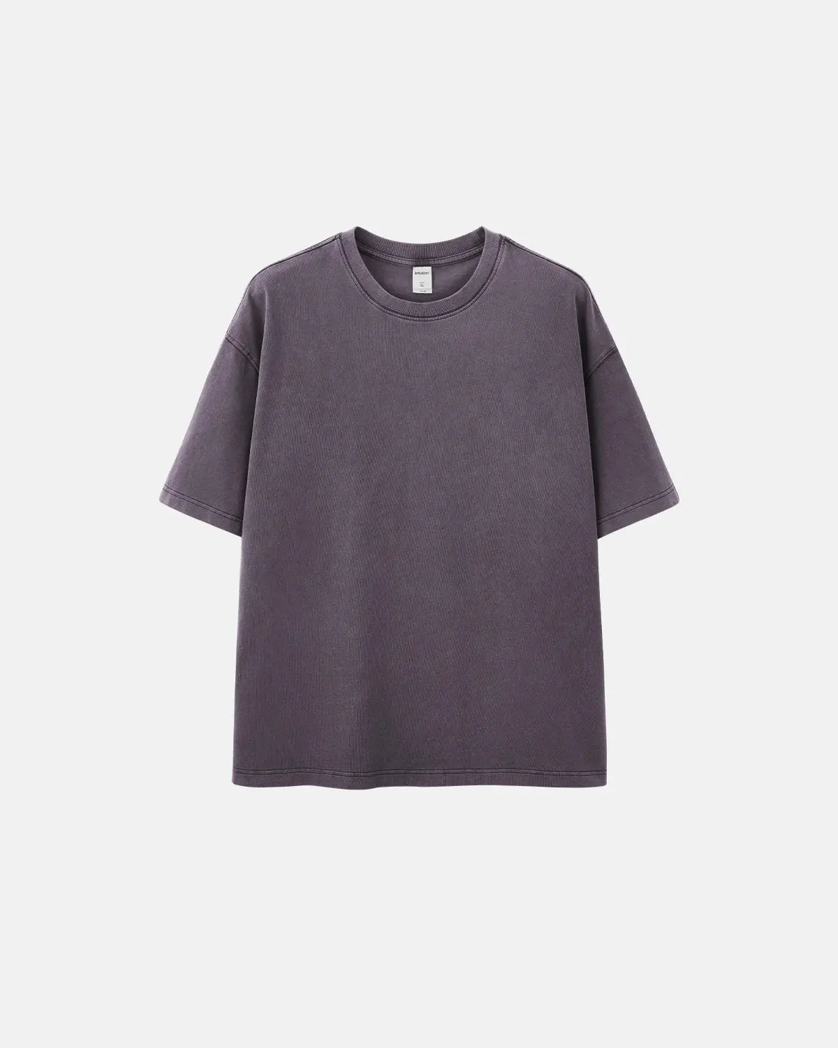 Oversized washed heavyweight T-shirt by Flation Streetwear, in a relaxed fit with a faded, vintage look, displayed on a hanger.