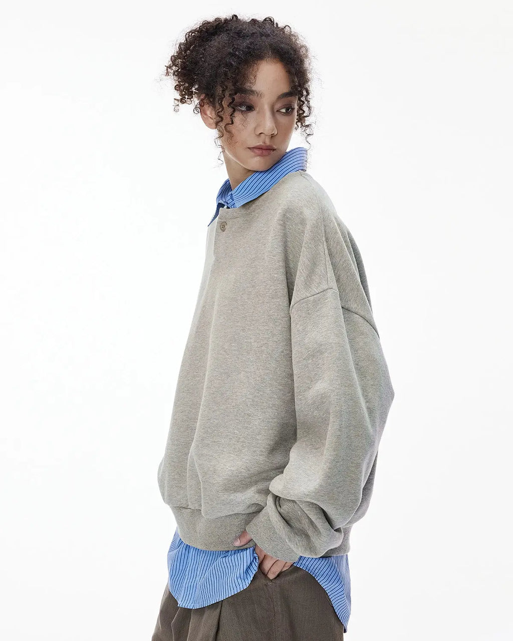 Boxy fit Flation streetwear Henley collar sweatshirt in neutral color, shown on a hanger with close-up fabric details.