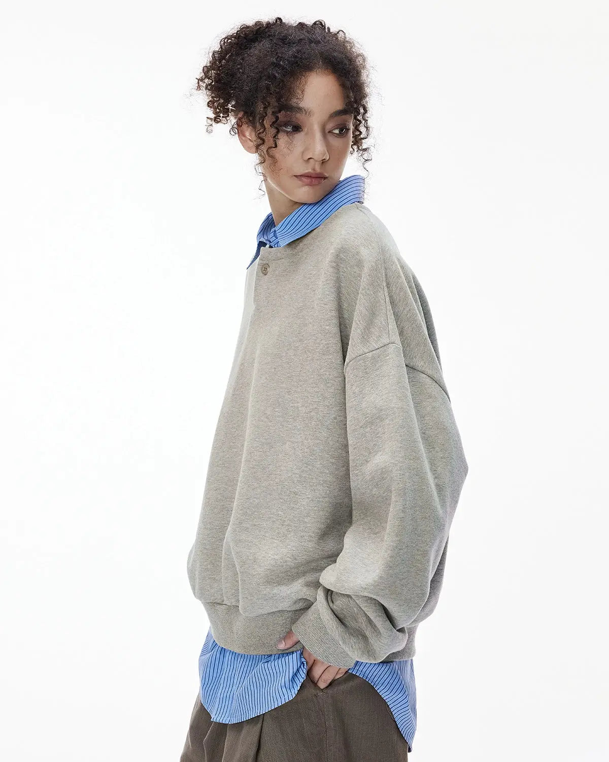 Boxy fit Flation streetwear Henley collar sweatshirt in neutral color, shown on a hanger with close-up fabric details.