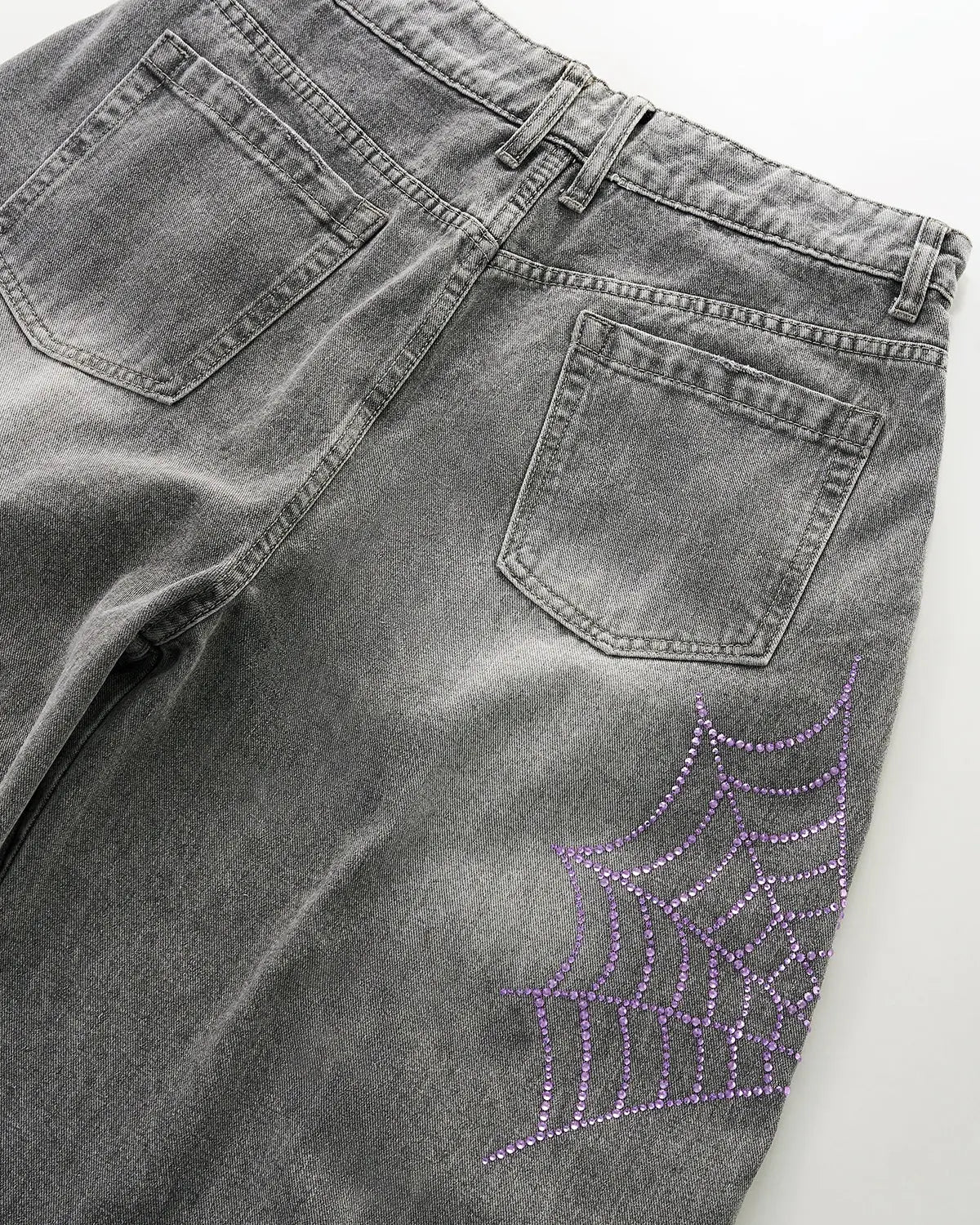 Flation Spider Graphic Rhinestone Barrel Jeans showing detailed spider and rhinestone embellishments on stylish denim pants