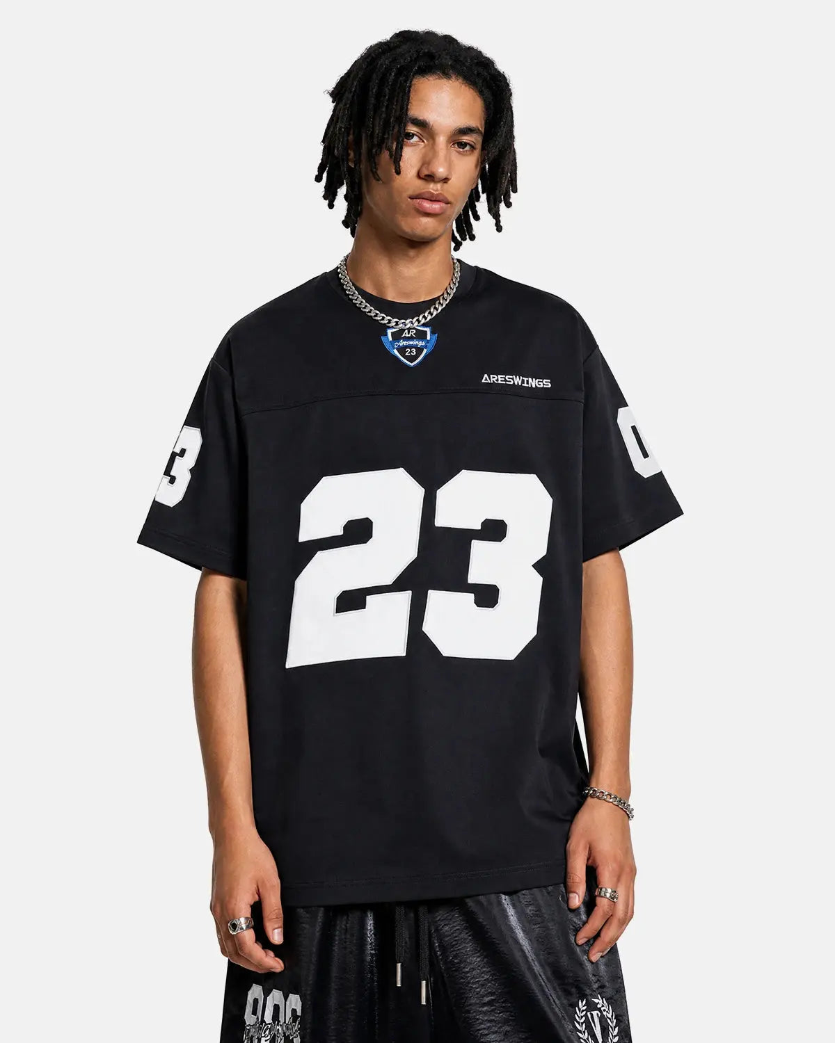 Inflation Streetwear varsity number applique T-shirt with bold embroidered number on white cotton fabric.