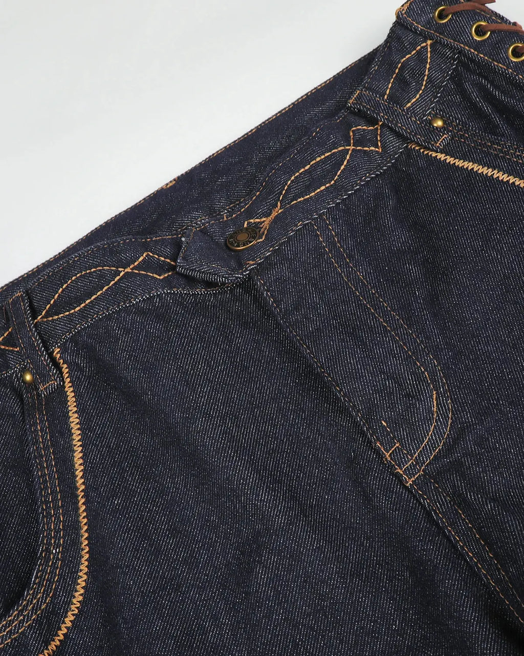 Side lace-up raw baggy jeans by INFLATION featuring relaxed fit, distressed detailing, and streetwear style.