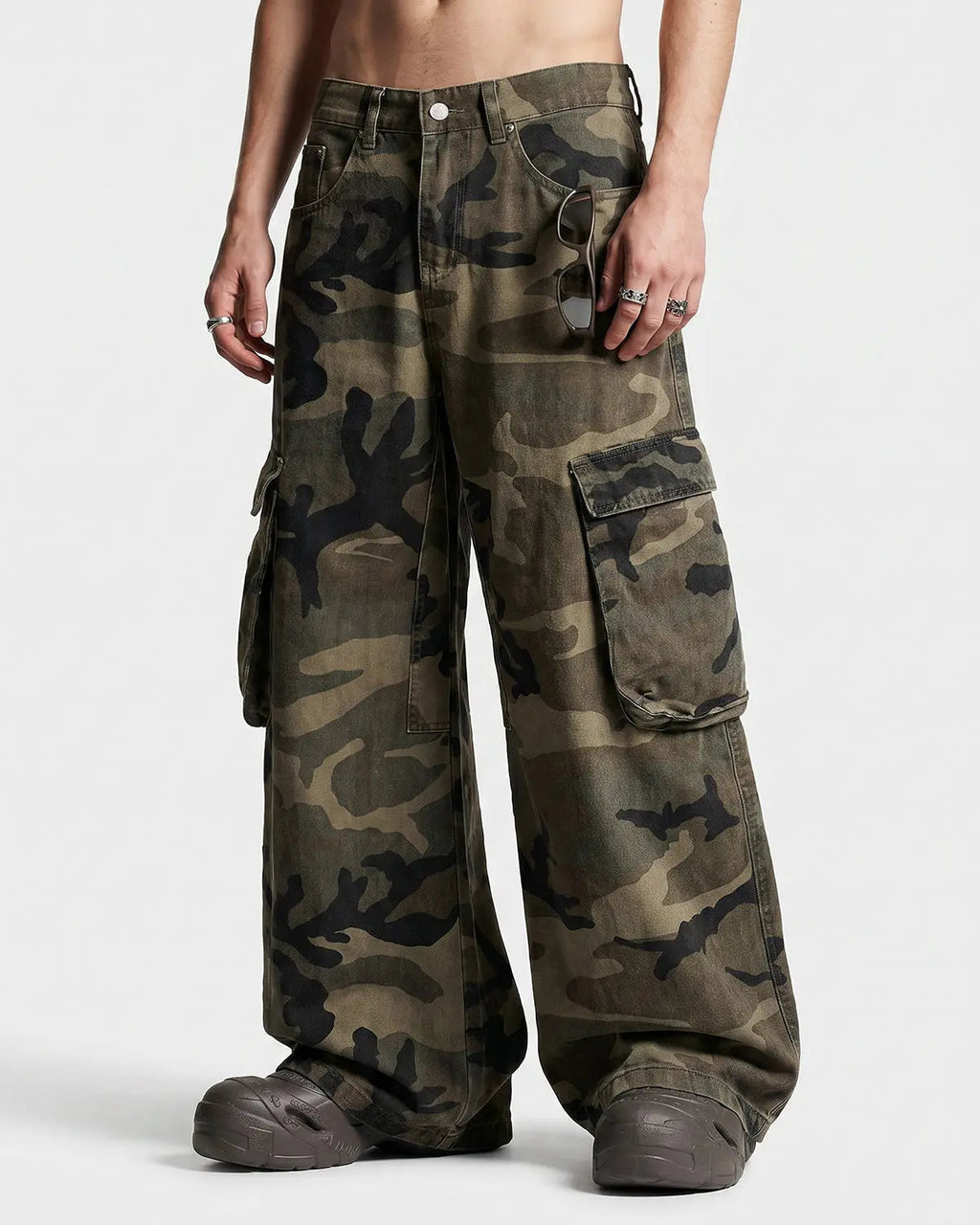 Inflation Camo Cargo Barrel Pants featuring camouflage pattern, multiple pockets, and relaxed streetwear style.