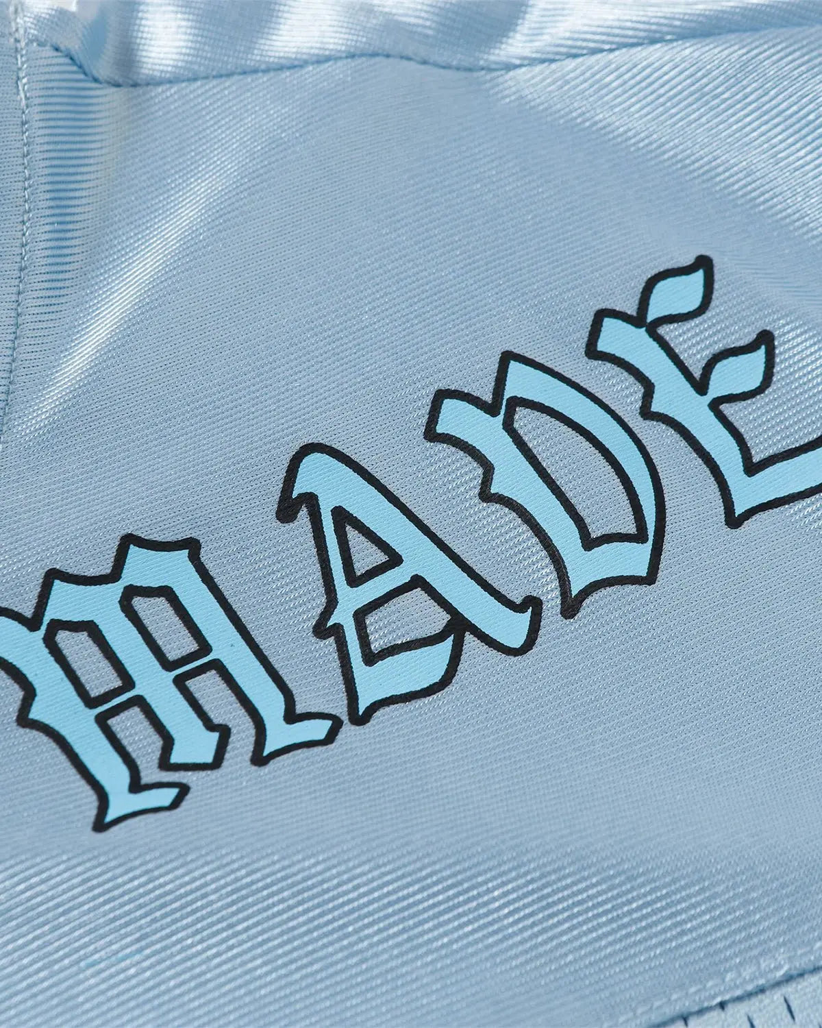 Oversized mesh patchwork jersey by Flation Streetwear featuring a mix of colorful mesh panels and relaxed fit.
