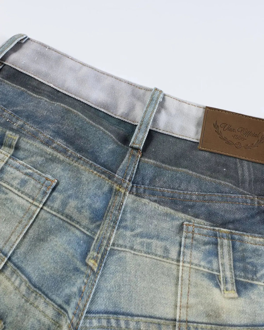 3D print multi-waist barrel jeans by INFLATION featuring unique layered design and streetwear style displayed on a mannequin.