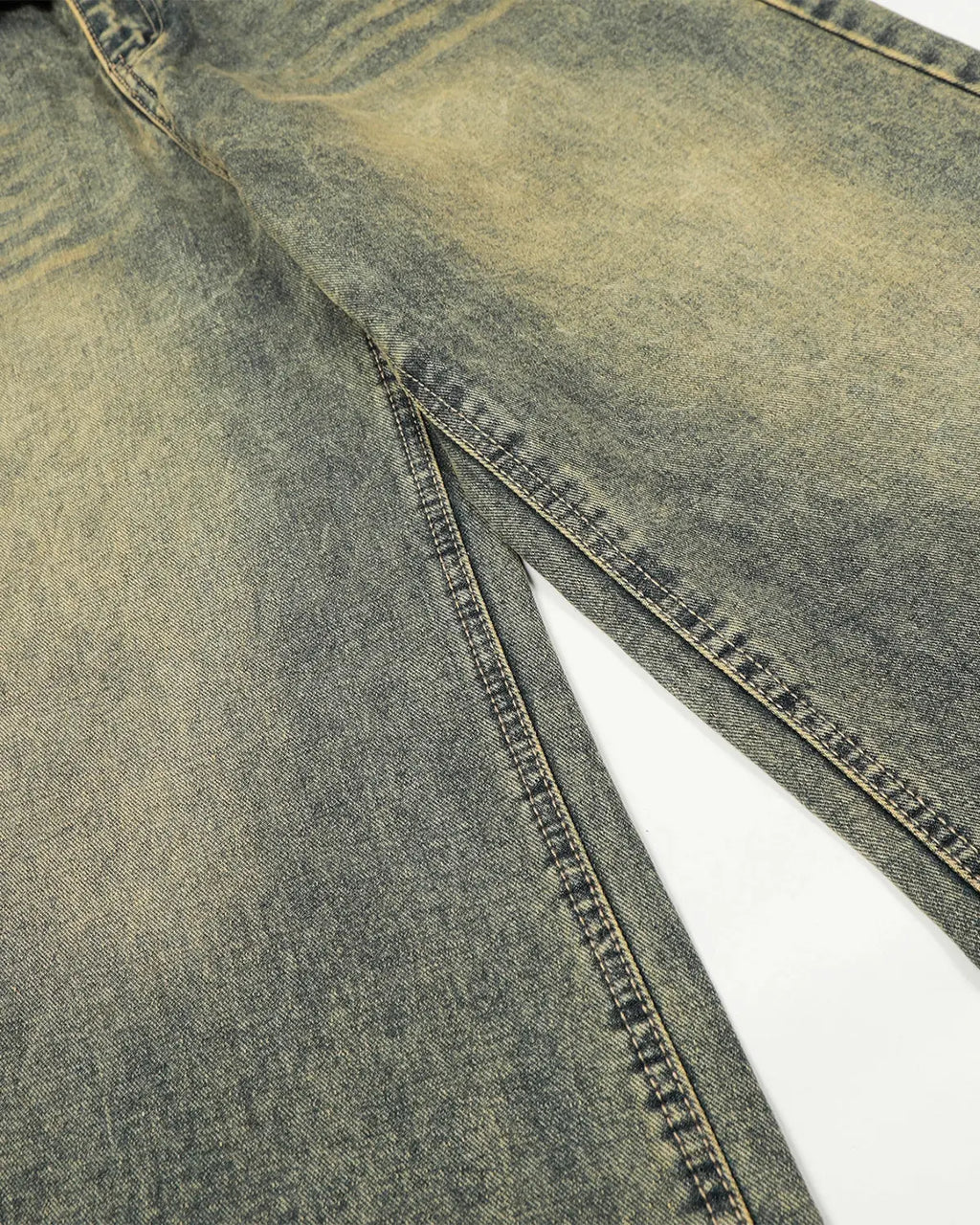 Distressed washed wide leg denim jeans by INFLATION featuring a relaxed fit and faded, ripped details in a streetwear style.