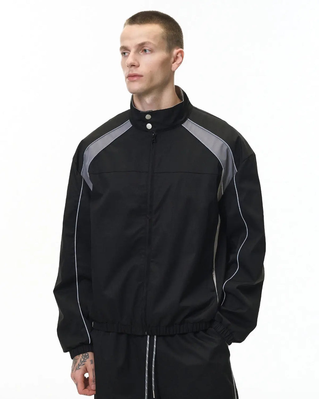 Reflective Flation streetwear windbreaker track jacket with reflective accents, lightweight and stylish for active outdoor wear.