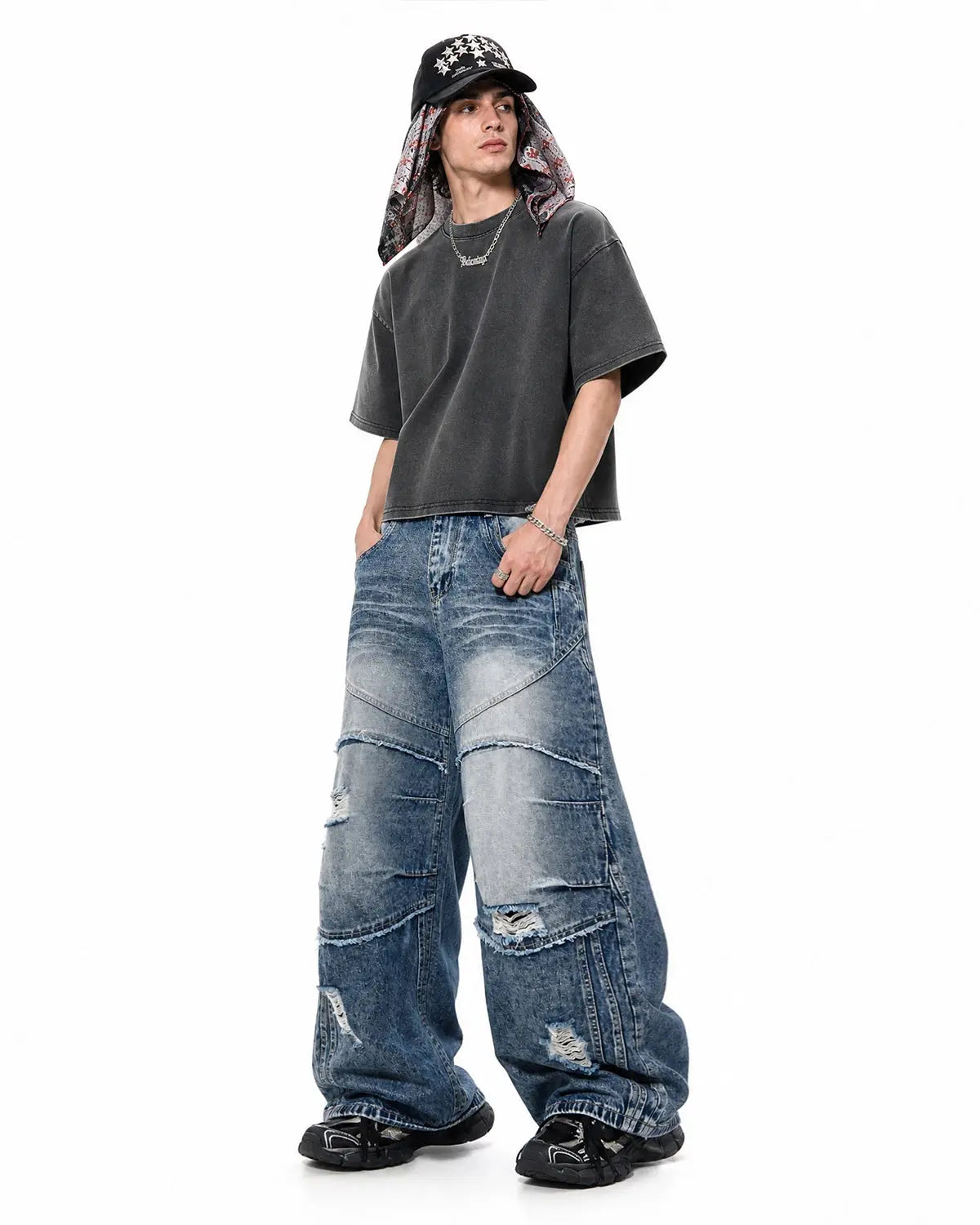 Inflation brand distressed barrel jeans with cinch back and deconstructed design, featuring a worn, vintage look.