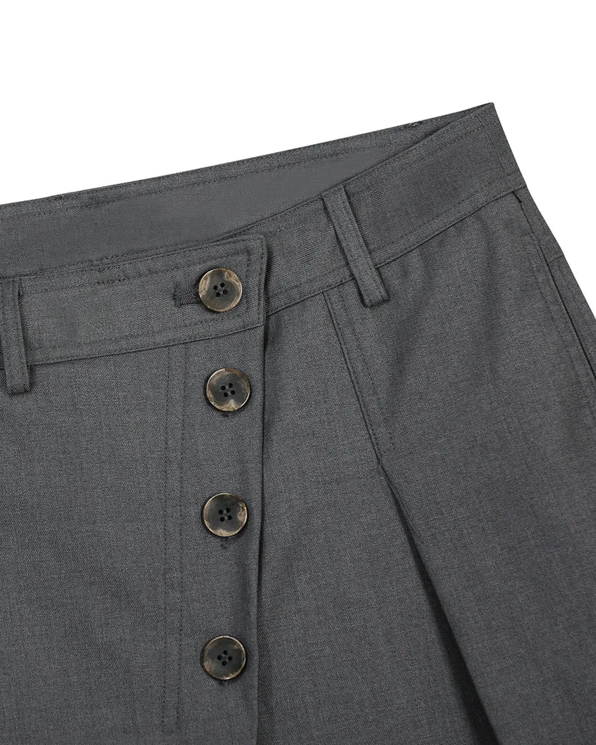 Asymmetric pleated barrel-leg suit pants by INFLATION, displayed in a stylish streetwear look, with a focus on unique pleats and tailored fit.