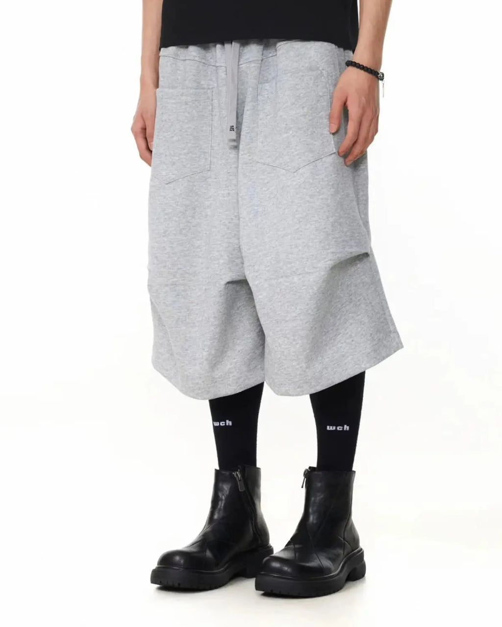 Flation Baggy Sweat Shorts, casual streetwear pants in soft fabric with a relaxed fit, shown in a neutral color.