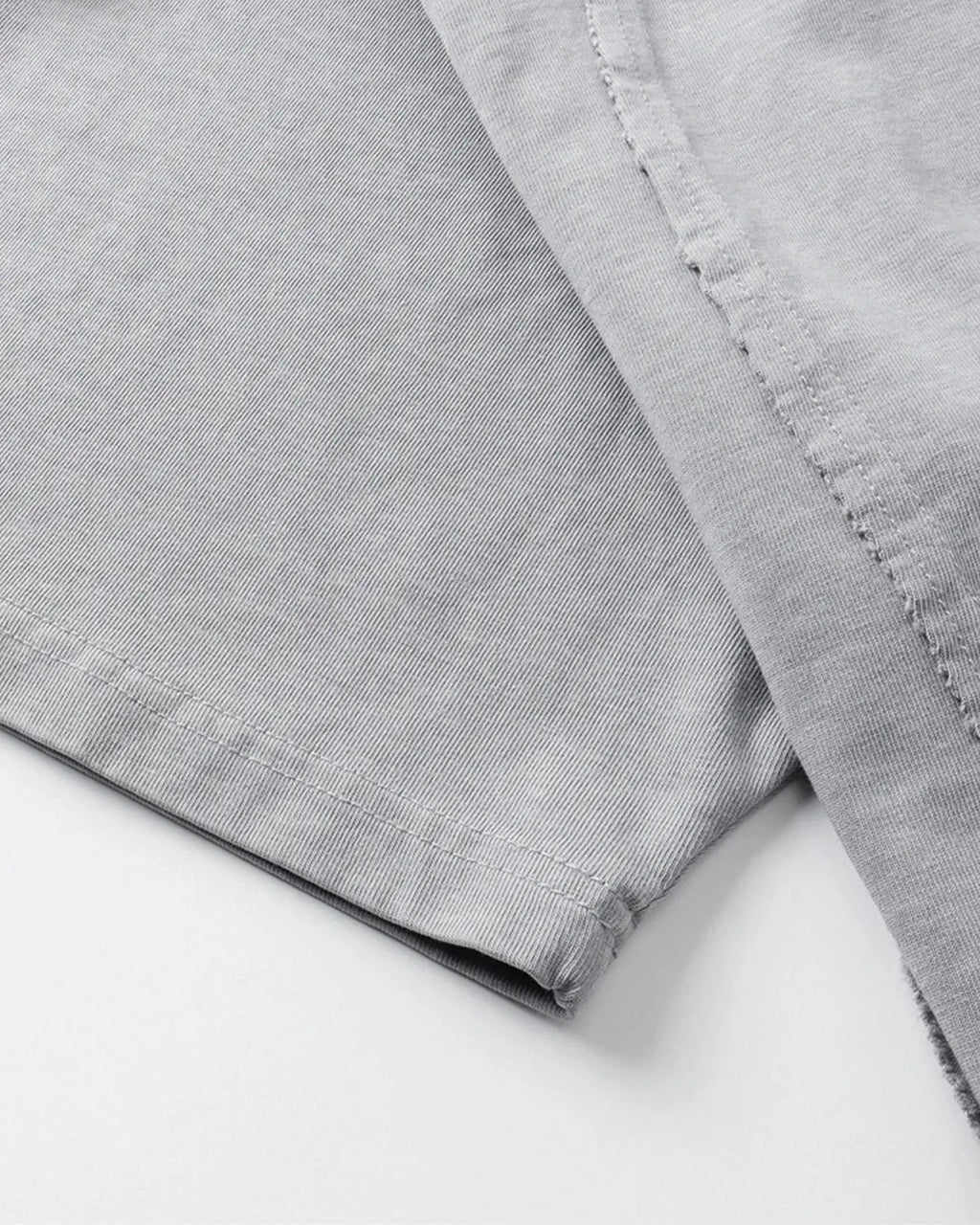 Acid wash boxy fit T-shirt by INFLATION featuring a relaxed, oversized streetwear style in light and dark wash denim tones.