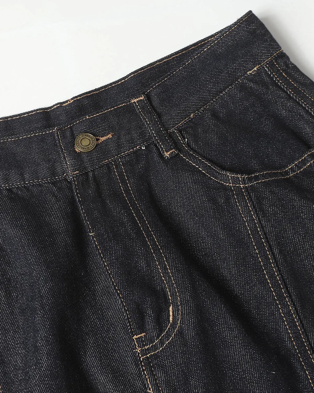 Deconstructed scimitar denim longline jorts by INFLATION, showcasing distressed, oversized design with raw hem and unique cutouts.
