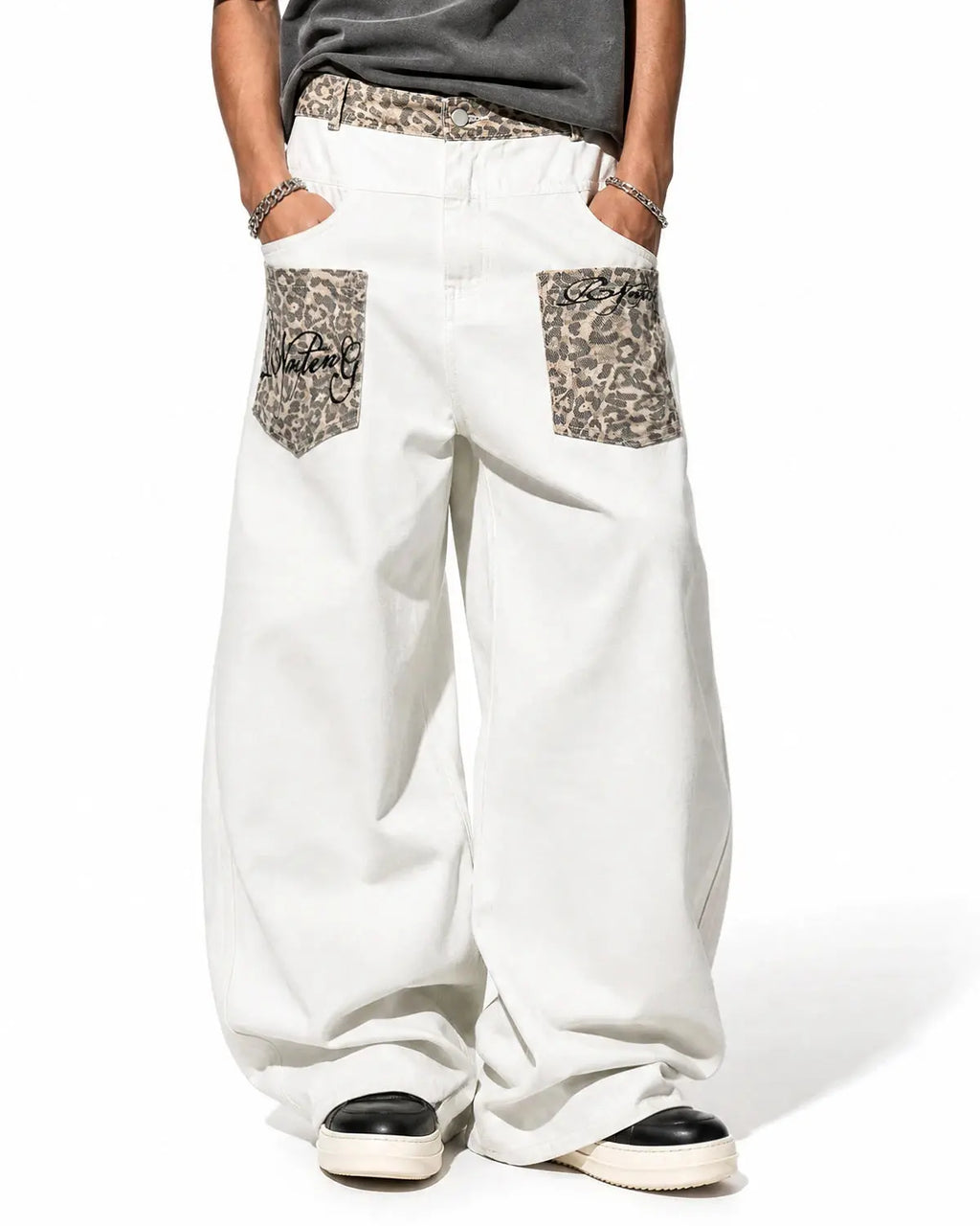 Leopard patch barrel jeans by INFLATION featuring a stylish leopard print patch design on classic denim jeans.