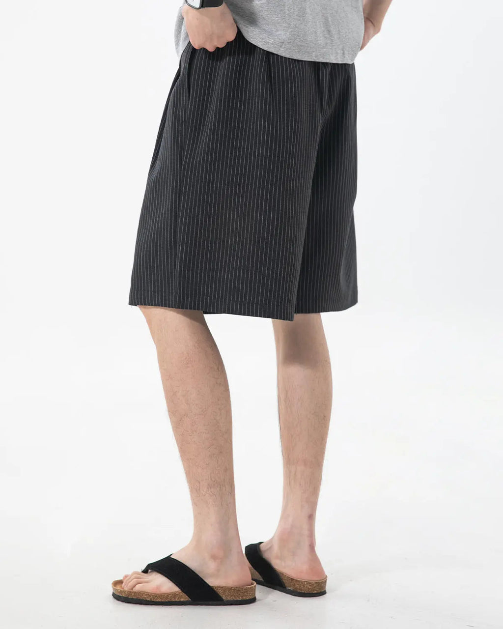 Inflation Streetwear pinstripe pleated tailored shorts, stylish pants with a fitted waistband and pleated front detail.