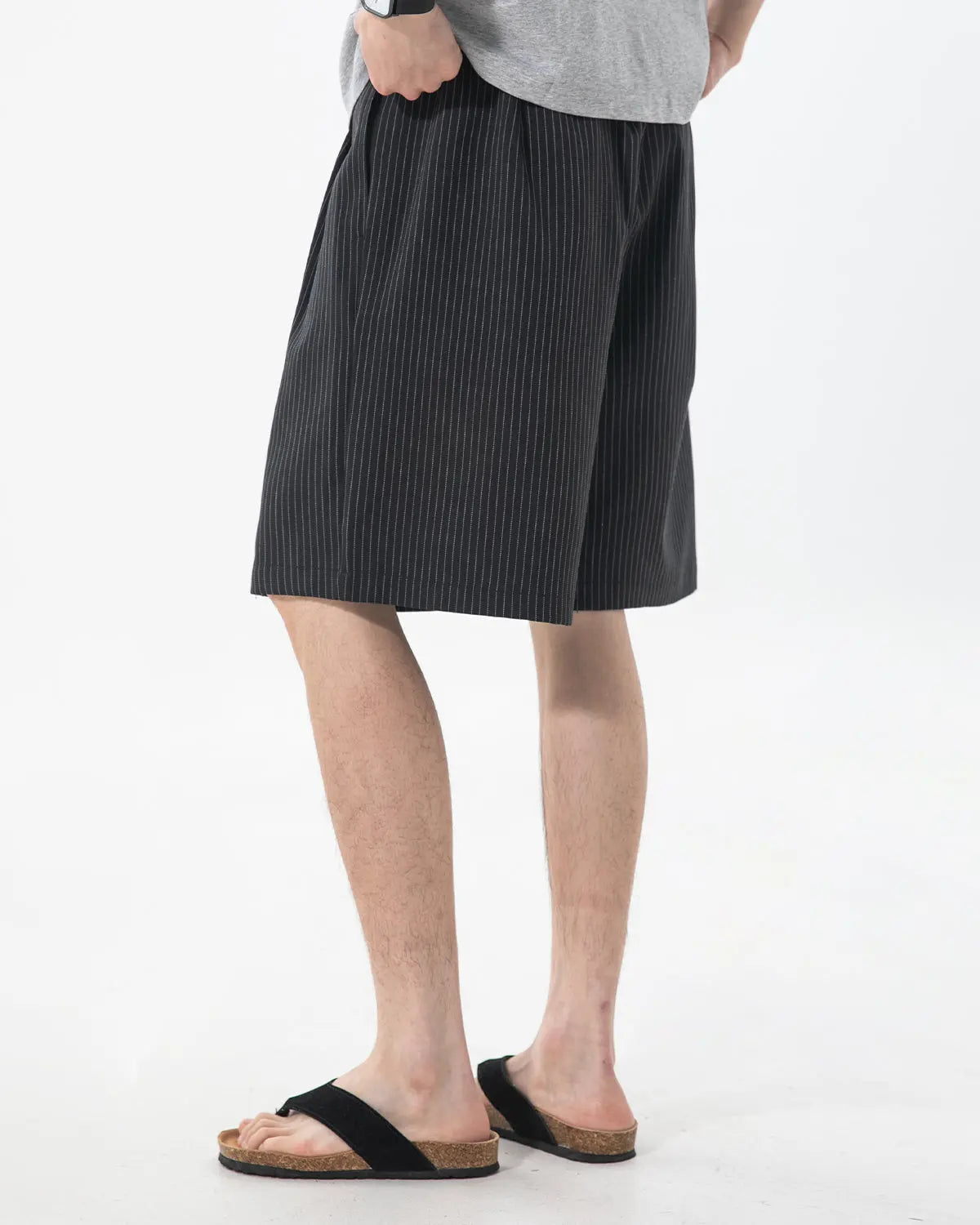 Inflation Streetwear pinstripe pleated tailored shorts, stylish pants with a fitted waistband and pleated front detail.
