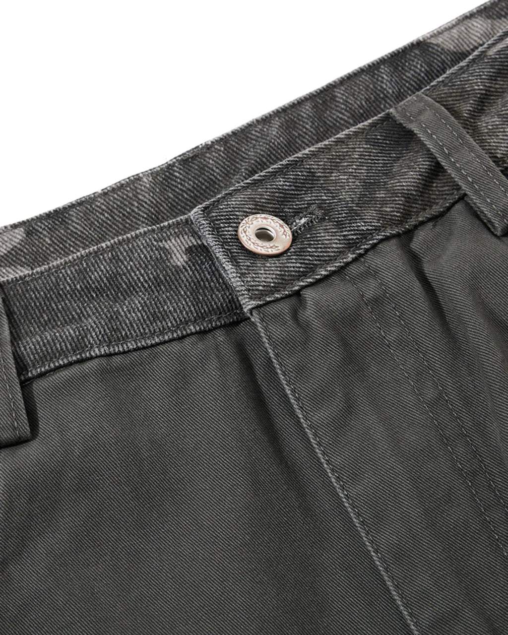 Inflation Streetwear camo patchwork barrel pants with relaxed fit and adjustable waist, featuring bold camouflage and patch details.