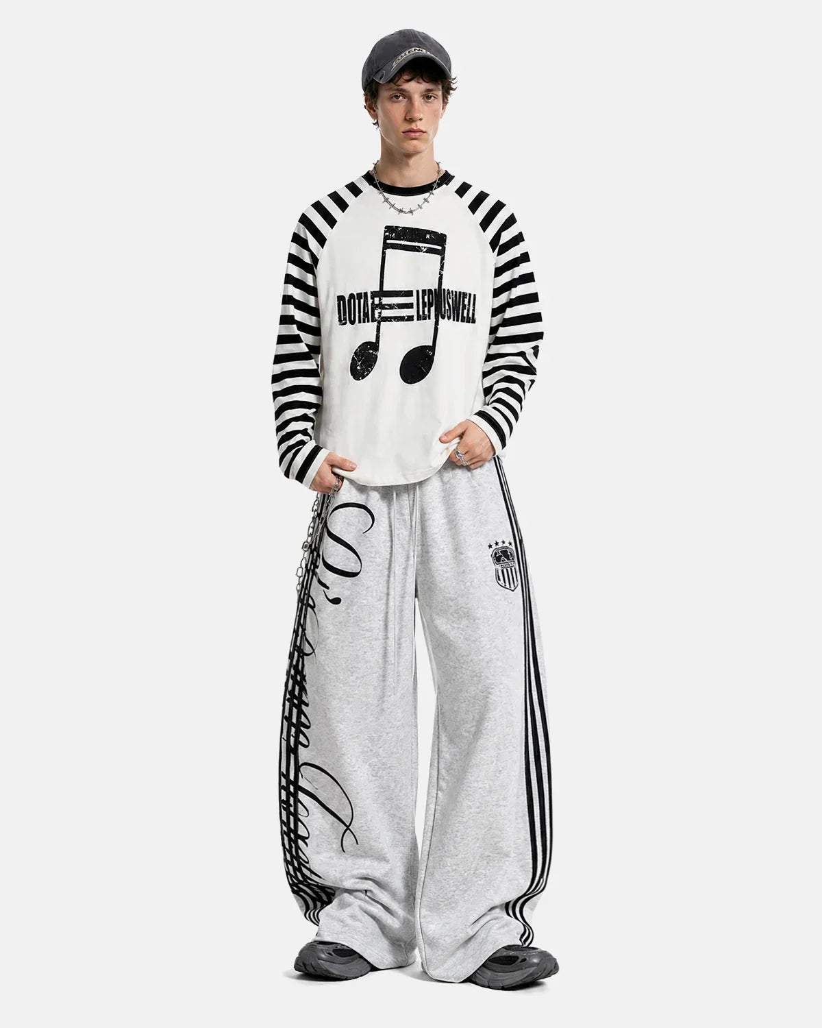 Inflation streetwear long sleeve T-shirt with bold music graphic and striped pattern, casual streetwear style for men and women.
