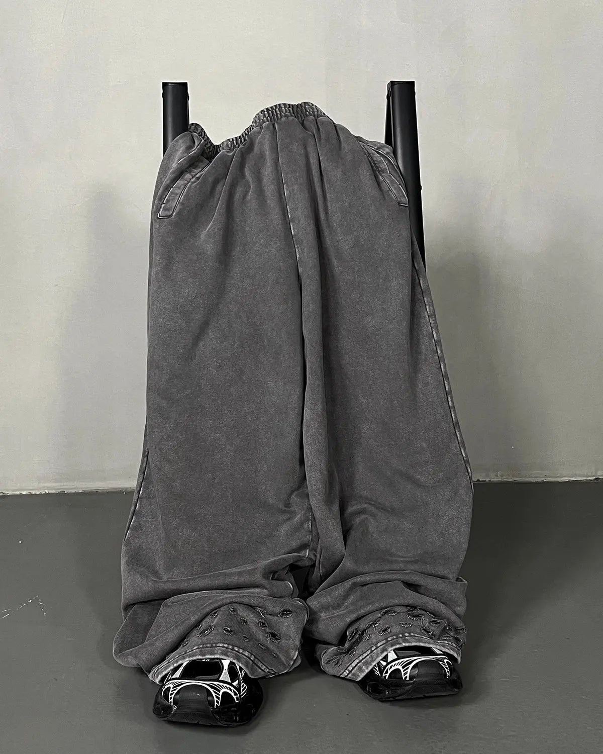 Flation ripped acid wash sweatpants with distressed details and relaxed fit, casual streetwear pants for a trendy look.