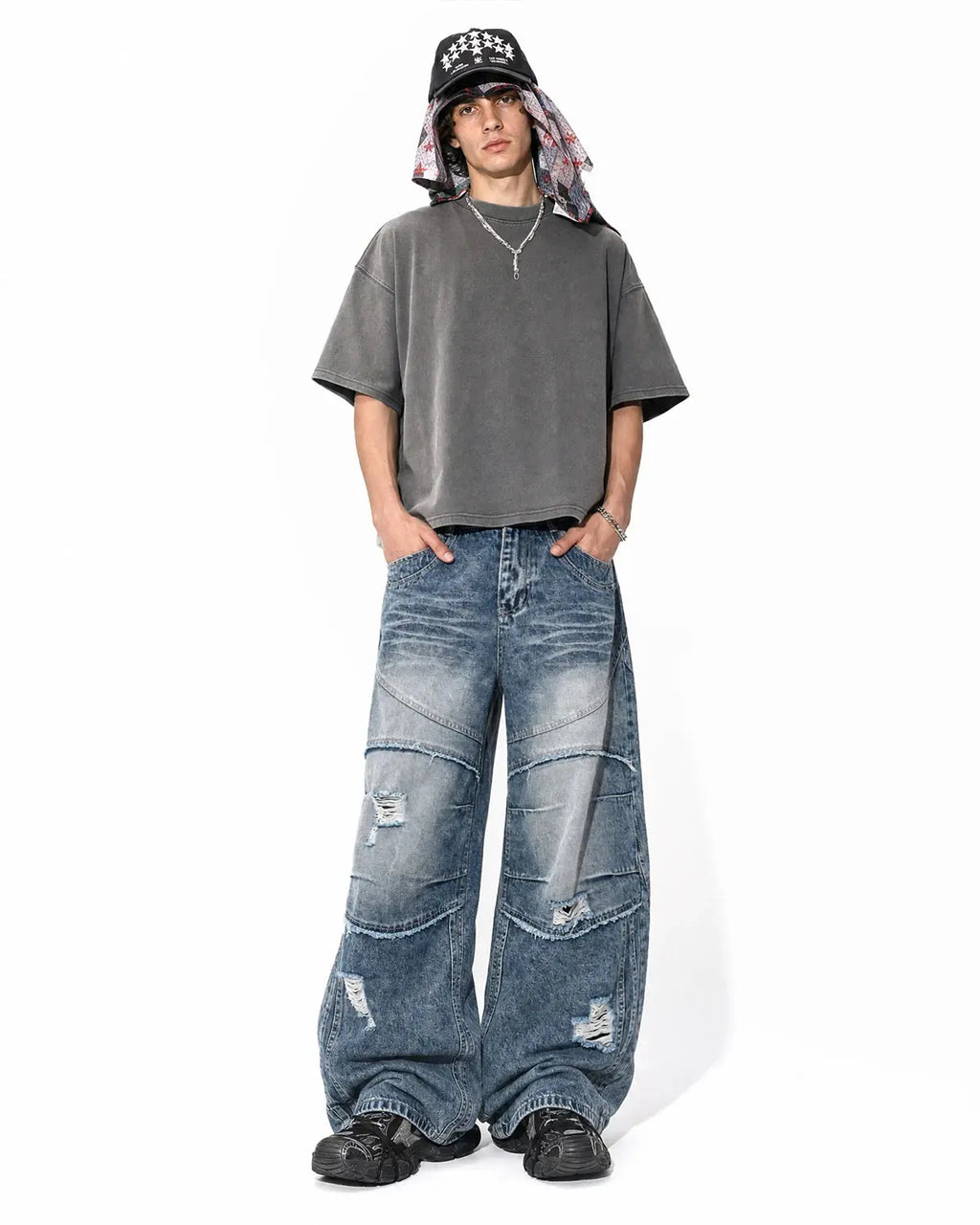 Inflation brand Cinch Back Deconstructed Distressed Barrel Jeans showing distressed denim, cinch back detail, and relaxed fit.