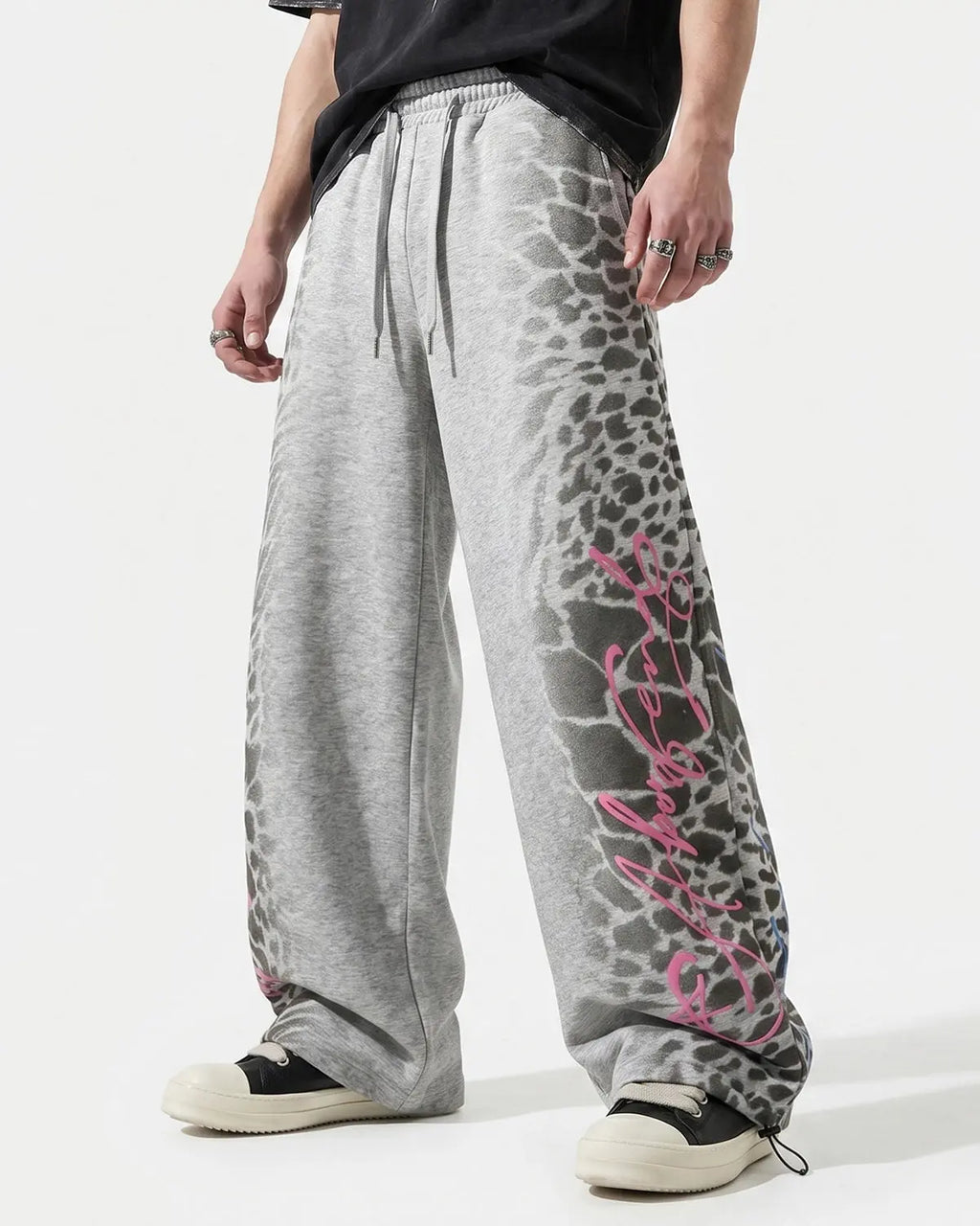Leopard graphic barrel sweatpants by INFLATION featuring bold animal print and comfortable streetwear style.
