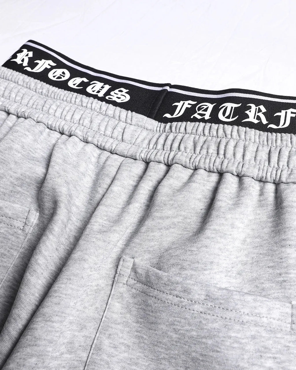 Gothic layered baggy sweatpants by INFLATION, streetwear style, showing the oversized fit and dark, edgy design details.