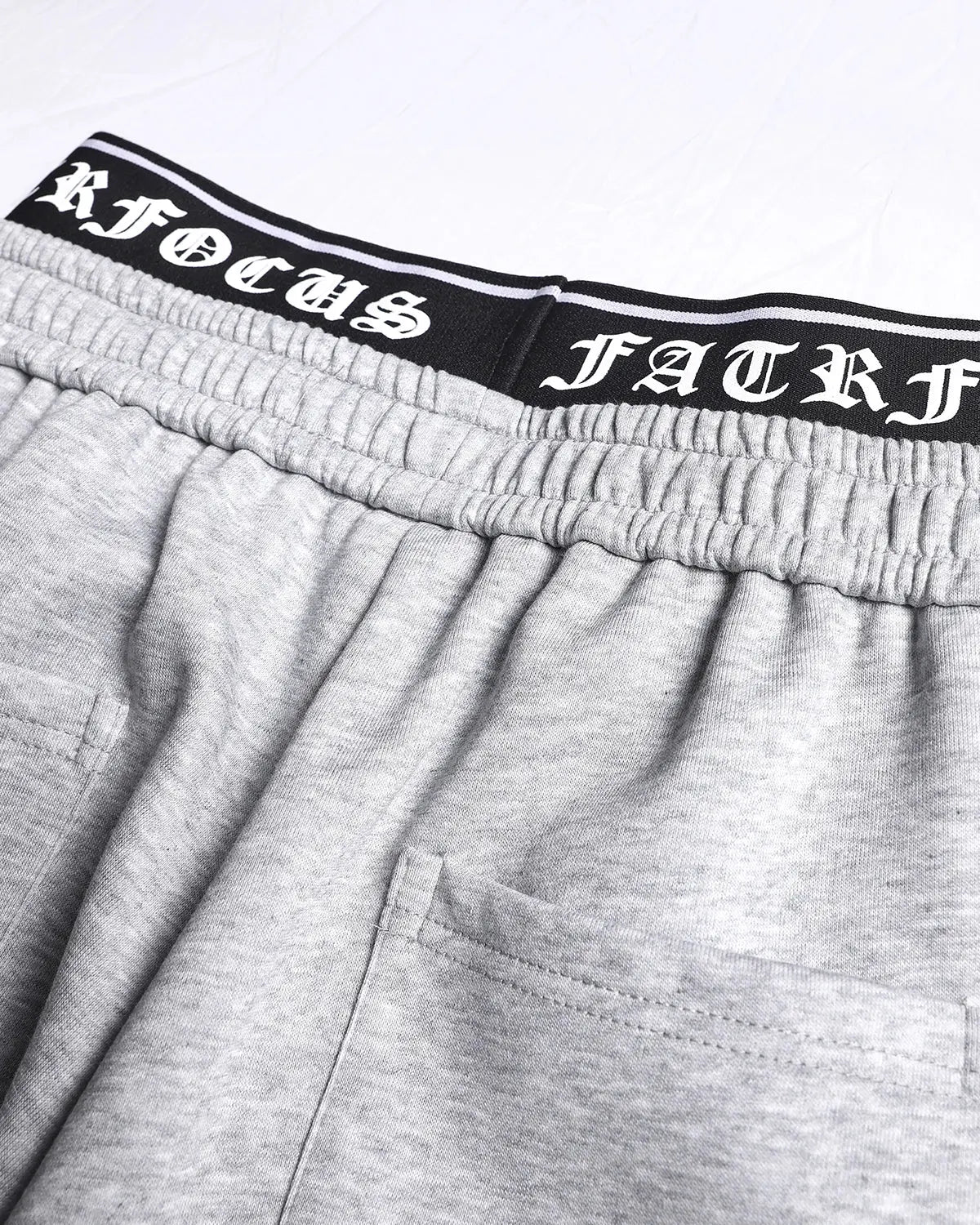 Gothic layered baggy sweatpants by INFLATION, streetwear style, showing the oversized fit and dark, edgy design details.