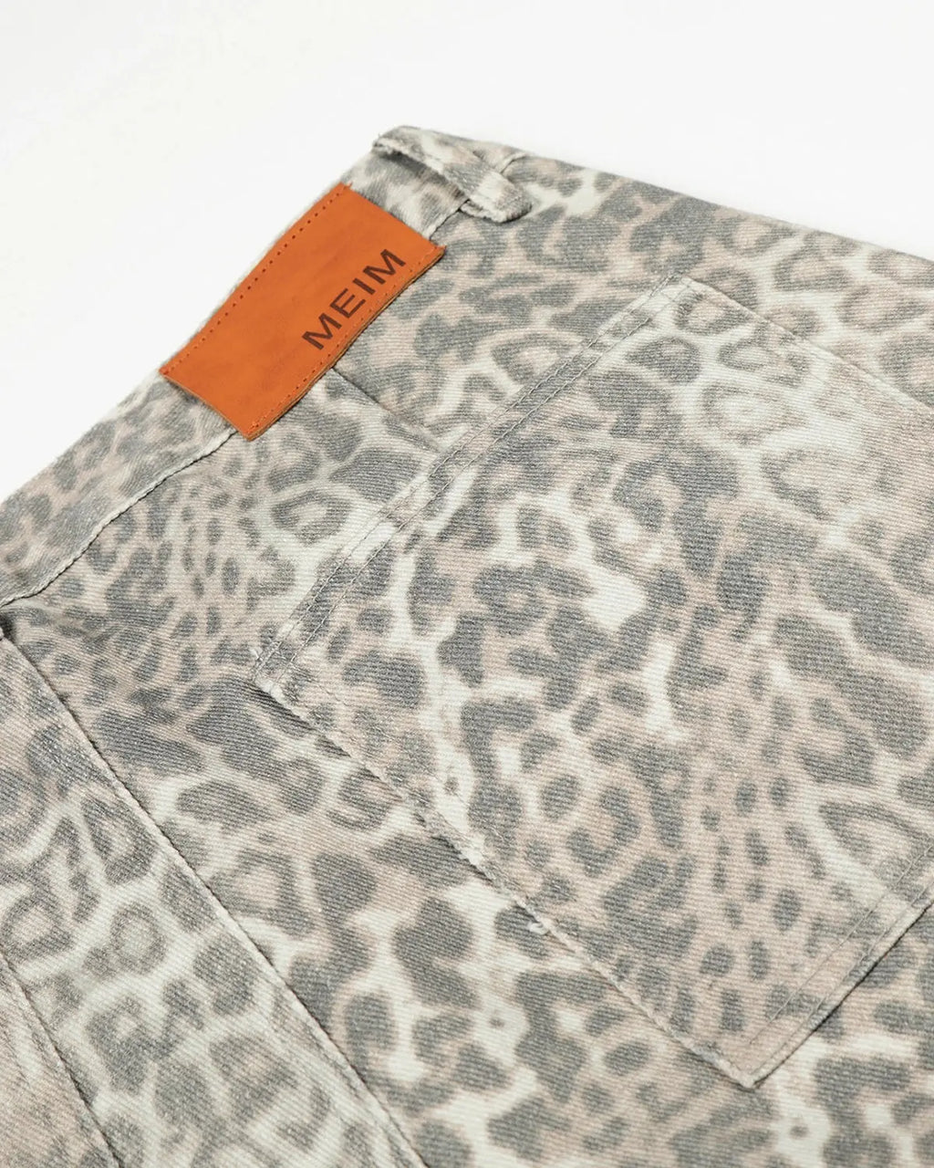 Leopard pattern cargo barrel pants by INFLATION streetwear, featuring a relaxed fit, multiple pockets, and bold animal print design.