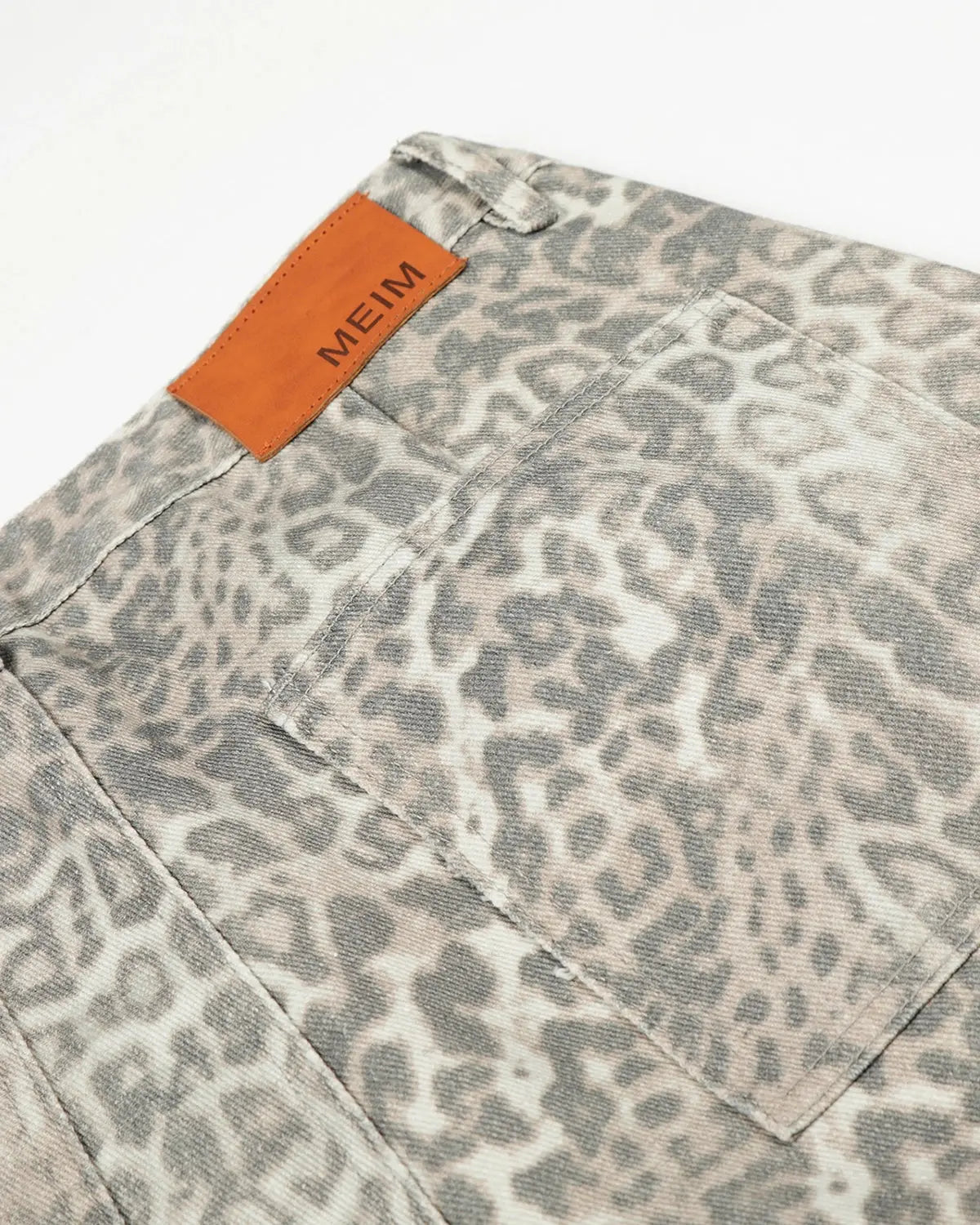 Leopard pattern cargo barrel pants by INFLATION streetwear, featuring a relaxed fit, multiple pockets, and bold animal print design.