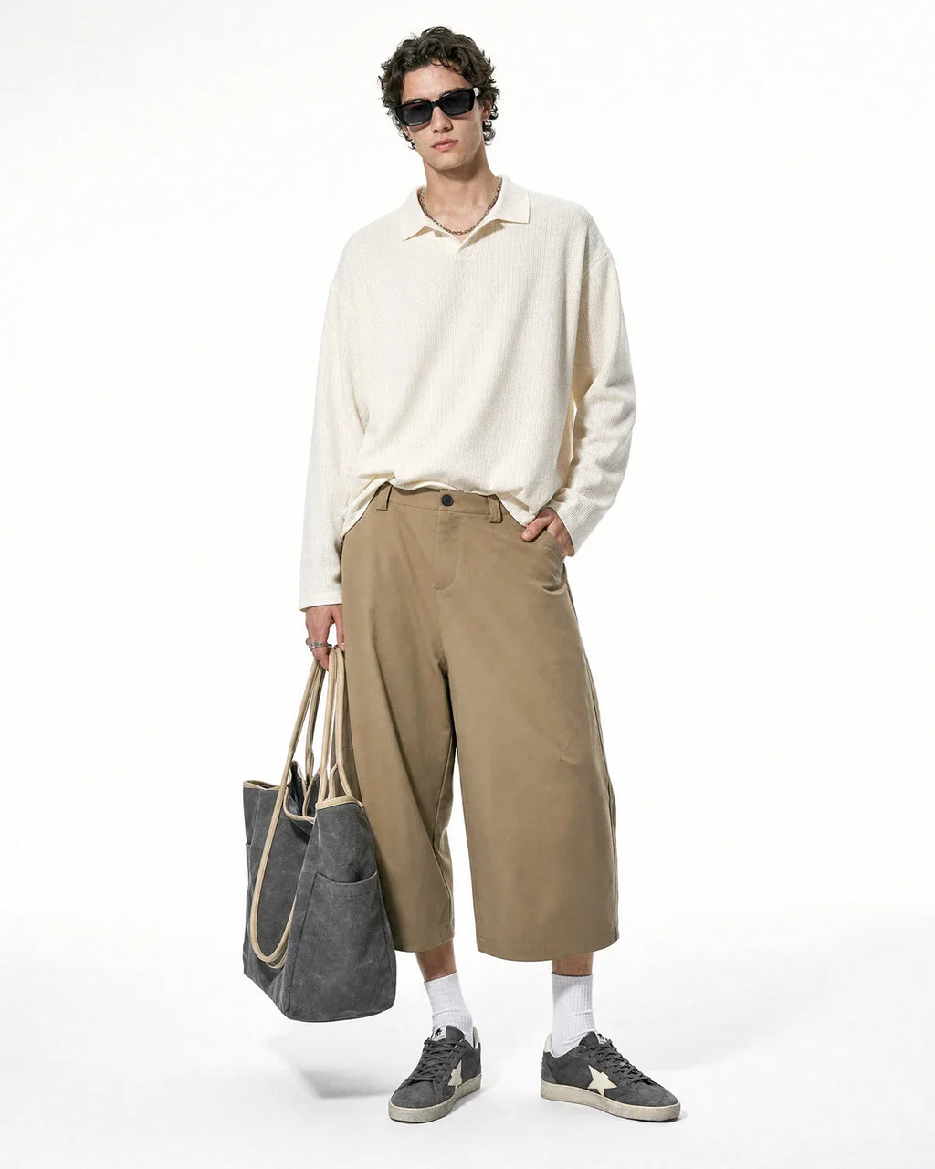 Flation Pleated Barrel Tailored Bermuda Shorts featuring a high waist, pleated design, and tailored fit in lightweight fabric.