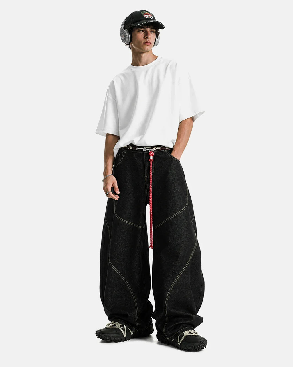 Acid wash stitching baggy jeans by Flation featuring distressed details and relaxed fit, styled with casual streetwear vibe.