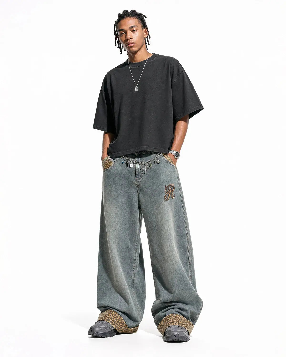 Leopard patchwork embroidery baggy jeans by INFLATION featuring relaxed fit, distressed details, and bold streetwear style.