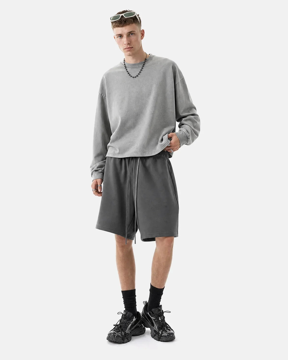 Heavyweight drawstring sweat shorts by INFLATION with a relaxed fit, featuring a waistband with adjustable drawstrings and casual style.