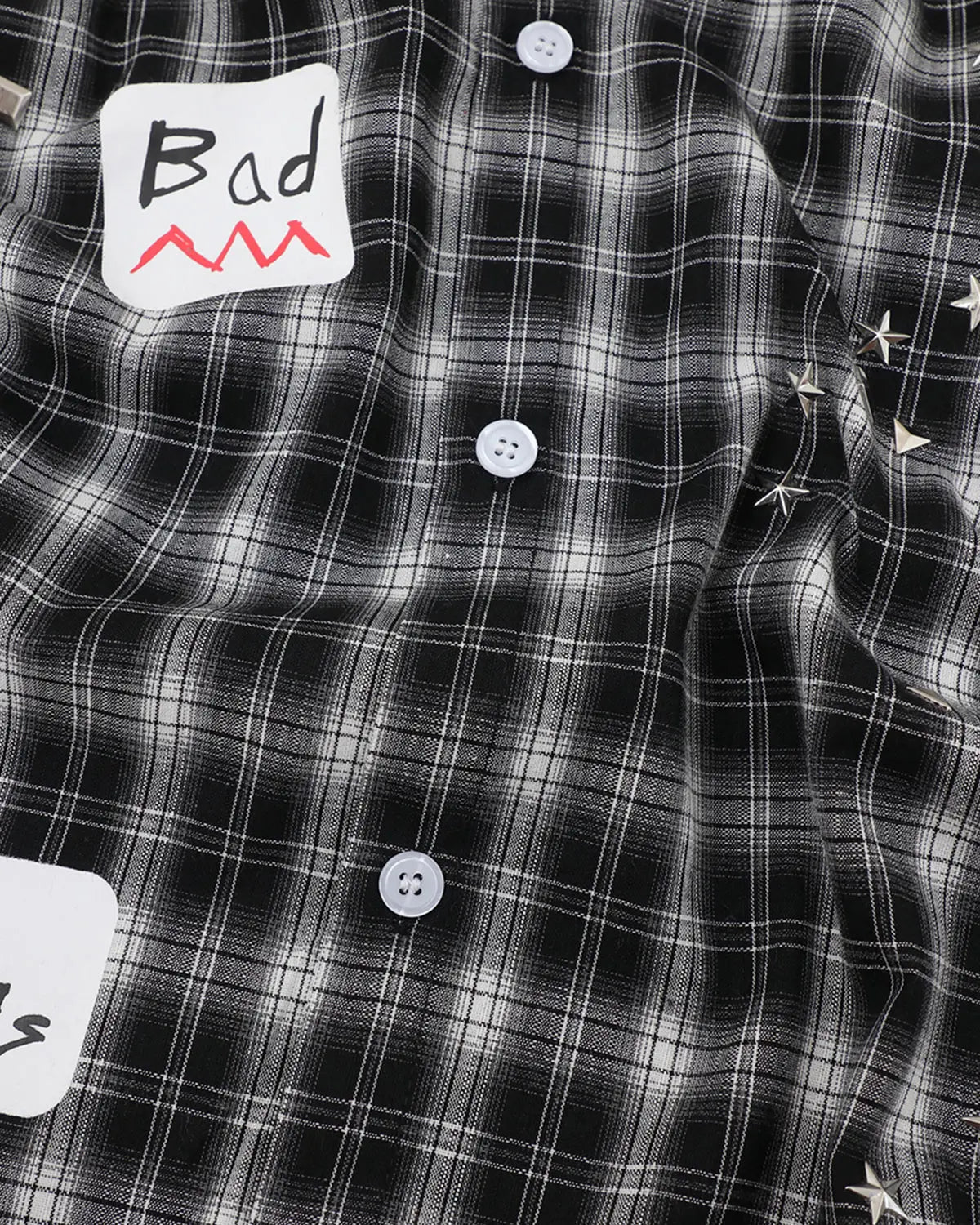 Inflation Streetwear plaid sticker graphic studded shirt featuring a checkered pattern, casual fit, and metal stud accents.