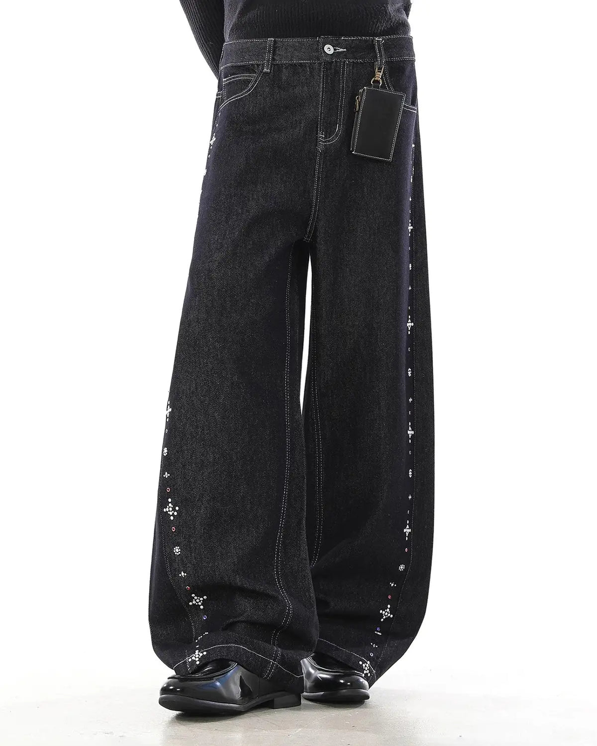 Inflation Studded Rhinestone Baggy Denim Jeans with embellishments and a relaxed fit, showcasing their stylish streetwear design.