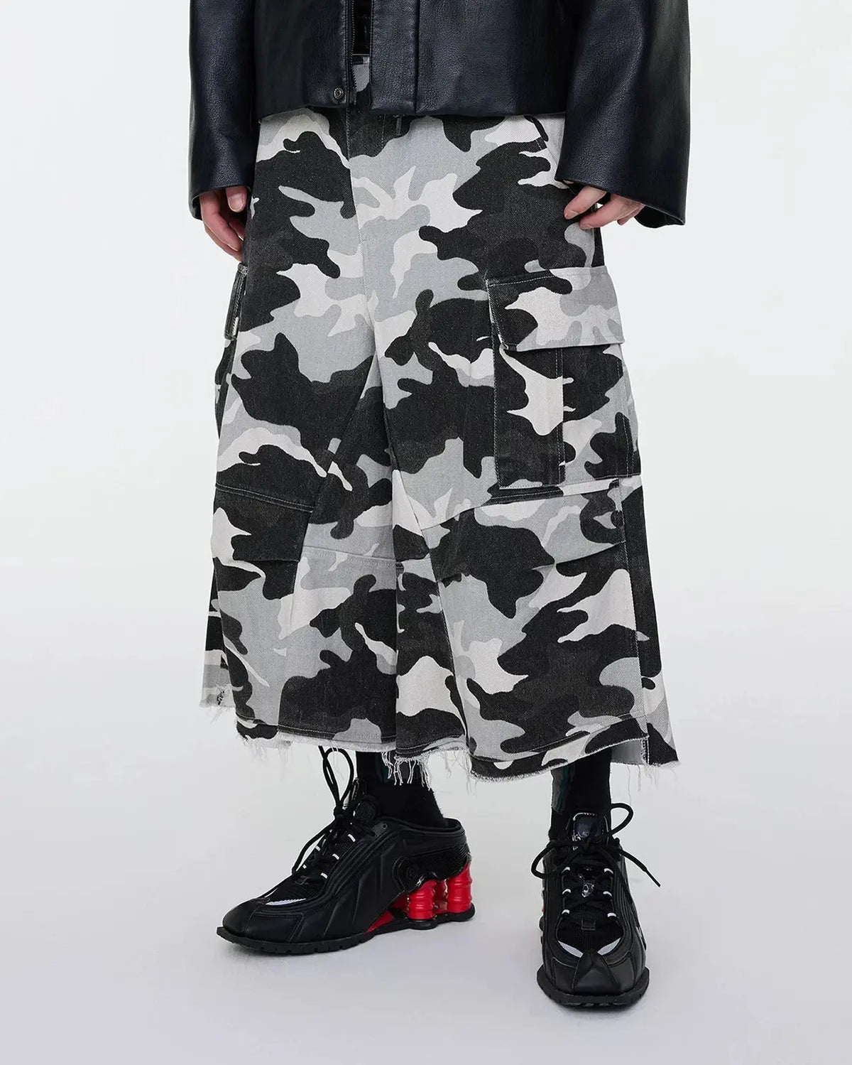 Inflation Glitter Camo Cargo Longline Shorts, stylish streetwear pants featuring glitter camo pattern and cargo pockets.