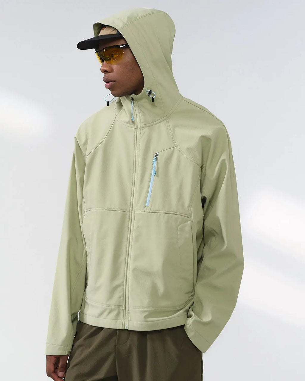 Inflation outdoor fleece-lined softshell hiking jacket with adjustable hood and zip pockets, ideal for outdoor adventures.