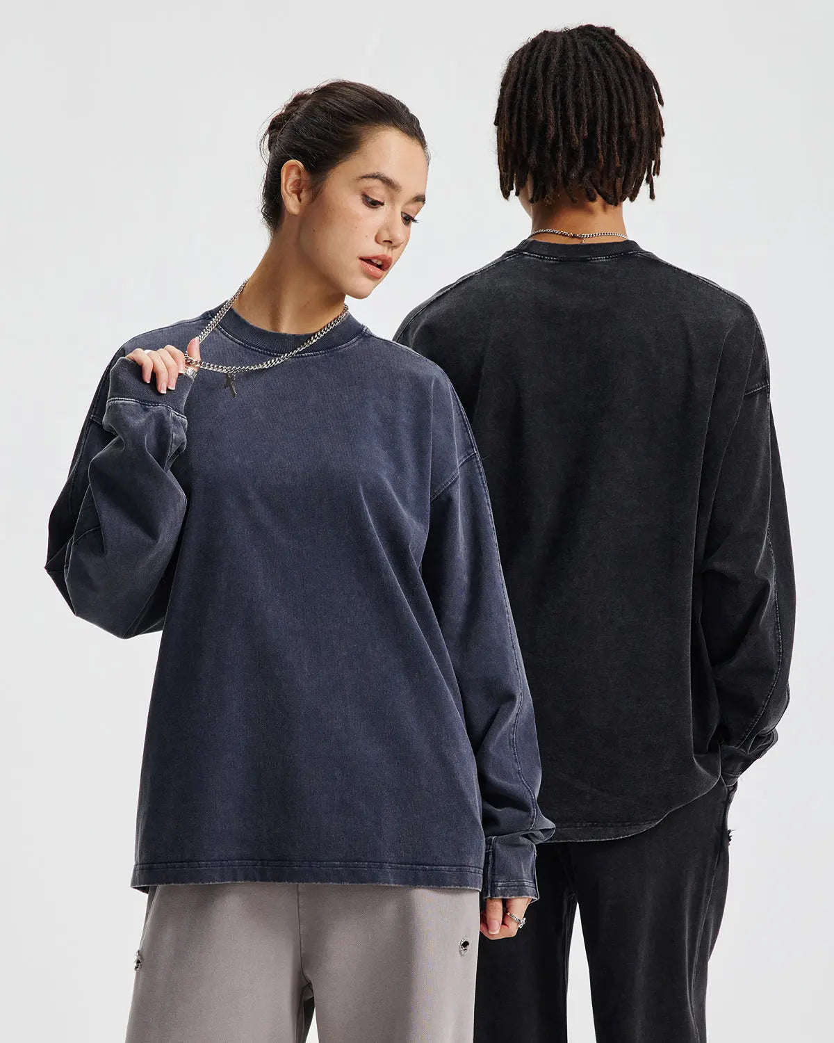 Oversized distressed acid wash long sleeve tee by Flation featuring a relaxed fit and vintage-inspired streetwear style.