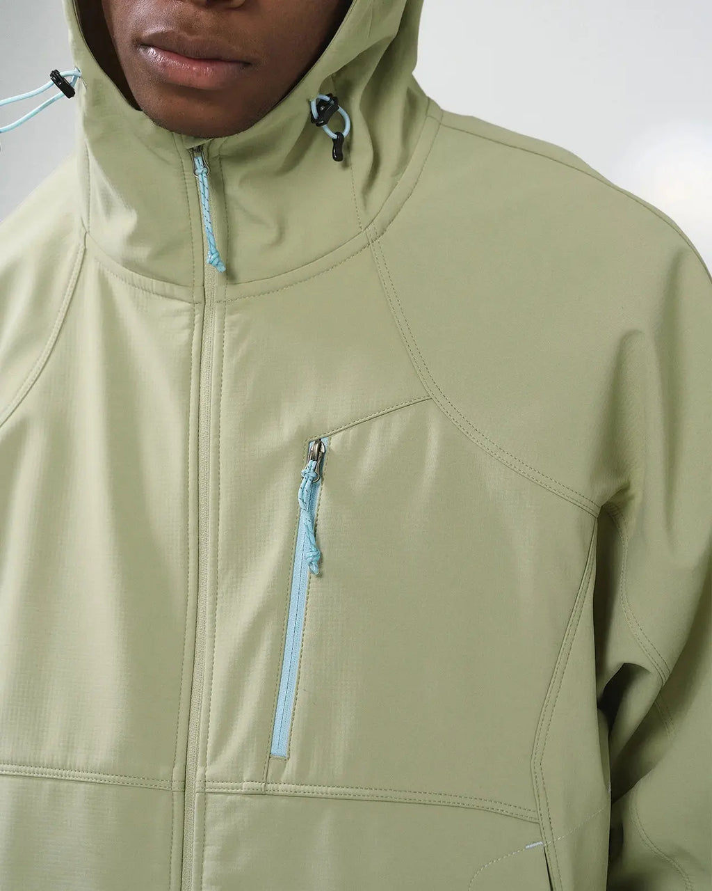 Inflation outdoor fleece-lined softshell hiking jacket with hood, showcasing durable fabric and comfortable fit for outdoor adventures.