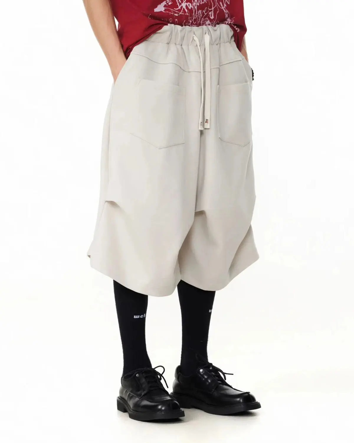 Baggy Sweat Shorts by INFLATION, stylish streetwear pants with a relaxed fit and comfortable design, shown on a model.