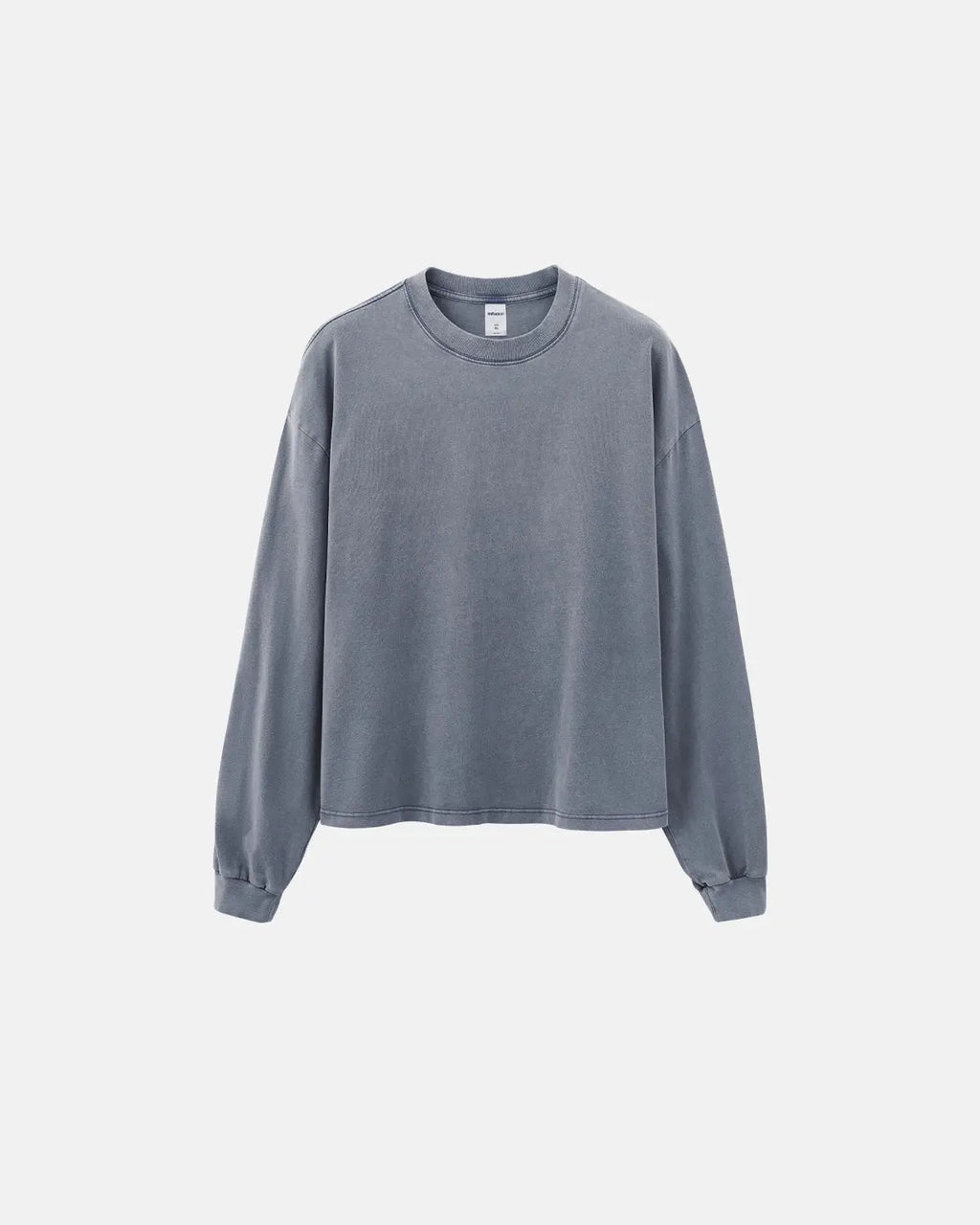 Distressed washed long sleeve tee by Flation featuring a relaxed fit and vintage-inspired design, displayed on a hanger.