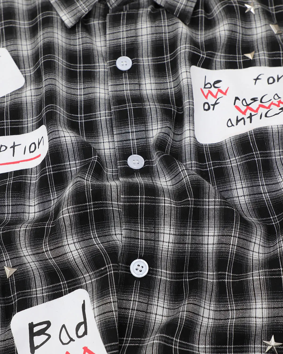 Inflation Streetwear plaid sticker graphic studded shirt with a bold plaid pattern and metal stud accents, casual streetwear style.